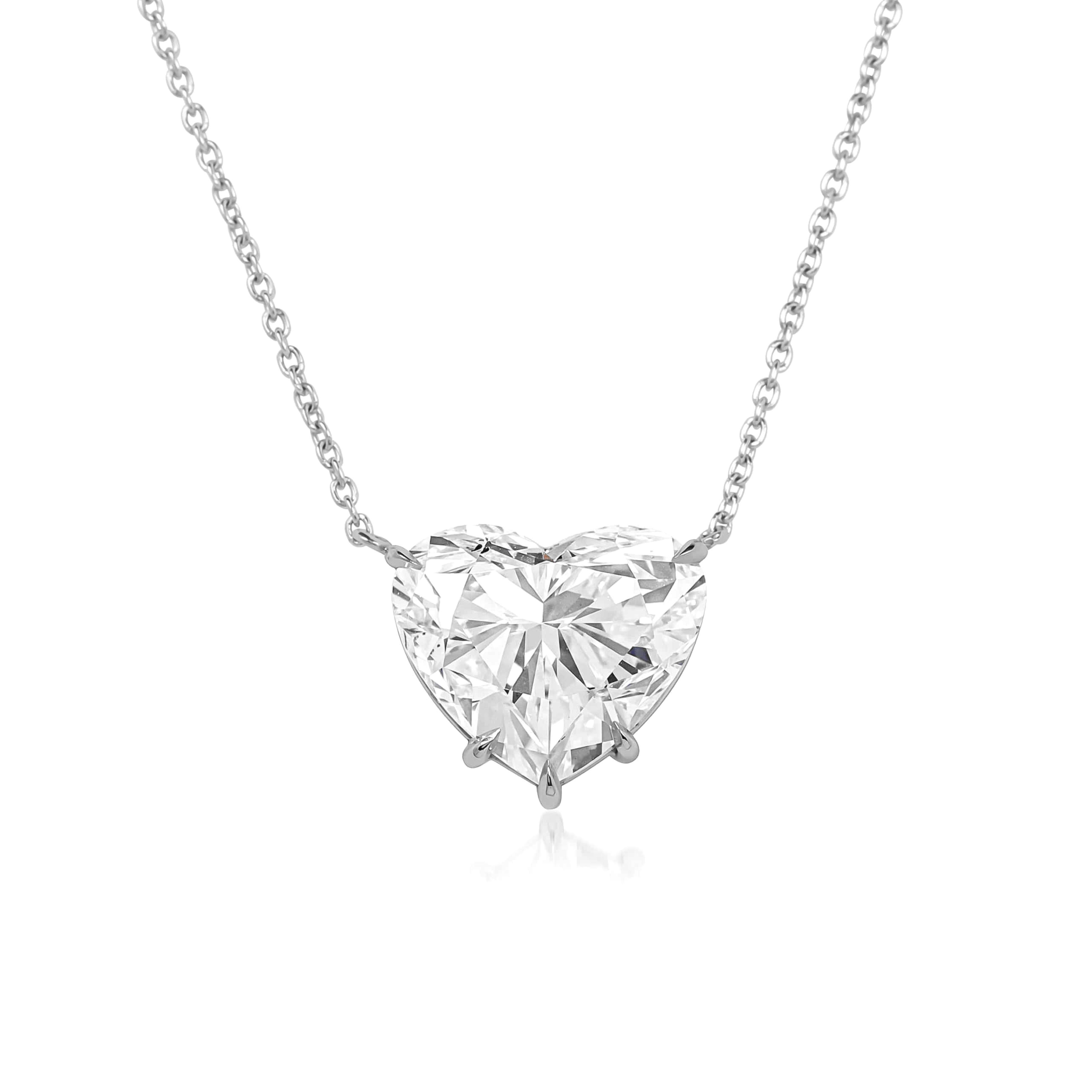 Stunning 3 ct natural heart cut diamond pendant made of solid platinum. This exquisite piece features VS1 2 clarity, ensuring breathtaking clarity and brilliance. With an D color grade, it showcases a colorless hue that enhances its sparkle. The