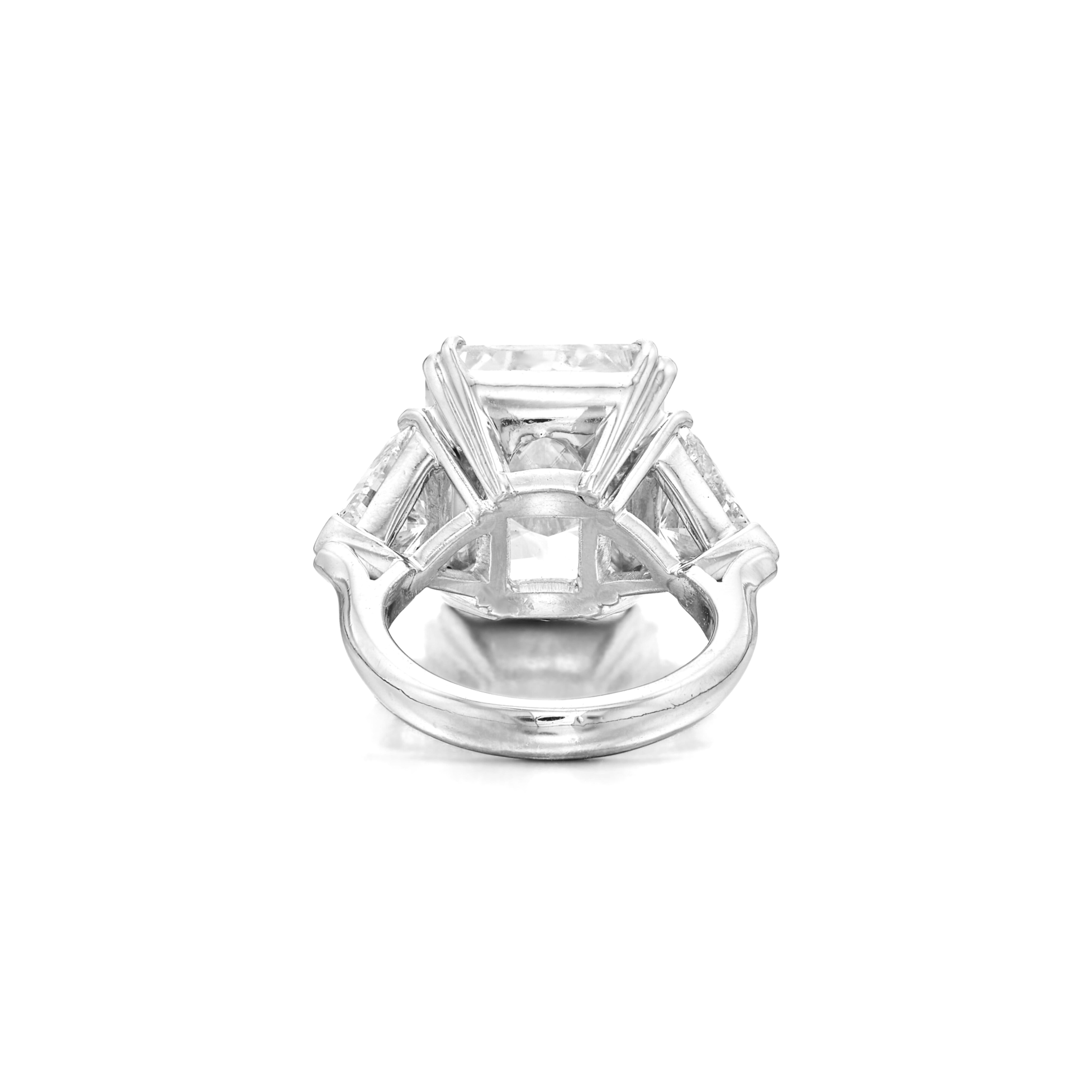 GIA Certified 3 Ct. Radiant Cut Diamond Ring, elegantly set in luxurious platinum. This stunning piece features two beautiful tapered baguette diamonds, showcasing D color and Vs1 clarity, enhancing the ring's brilliance and sophistication. Perfect