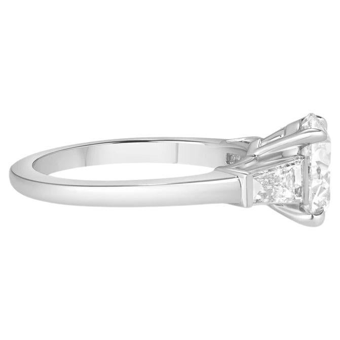 This stunning engagement ring features a GIA certified 3.01 carat round cut diamond, elegantly set in platinum for a timeless and refined look.

The diamond boasts a pristine F color grade, showcasing a pure, near colorless brilliance that enhances
