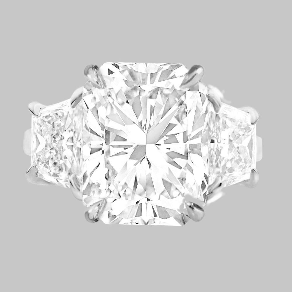 Indulge in the timeless allure of this GIA Certified 3.01 Ct Three Stone Long Radiant Cut Diamond Ring in Platinum, a true embodiment of luxury and sophistication. At the heart of this exquisite ring gleams a radiant-cut diamond of unparalleled