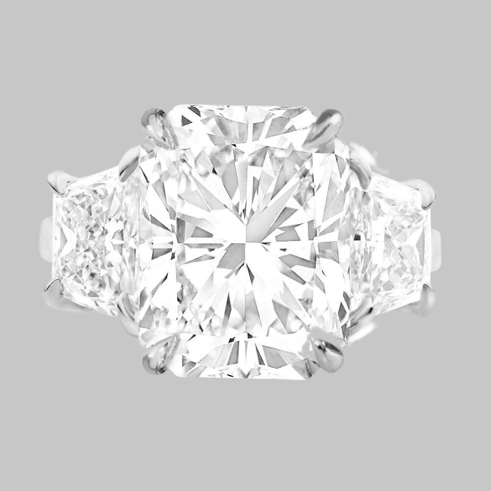 This stunning engagement ring features a 3.01 carat long radiant cut diamond, set in a luxurious platinum band. 

With its brilliant near-colorless quality, this E graded diamond is a versatile and stunning choice. 
This VS1 diamond offers