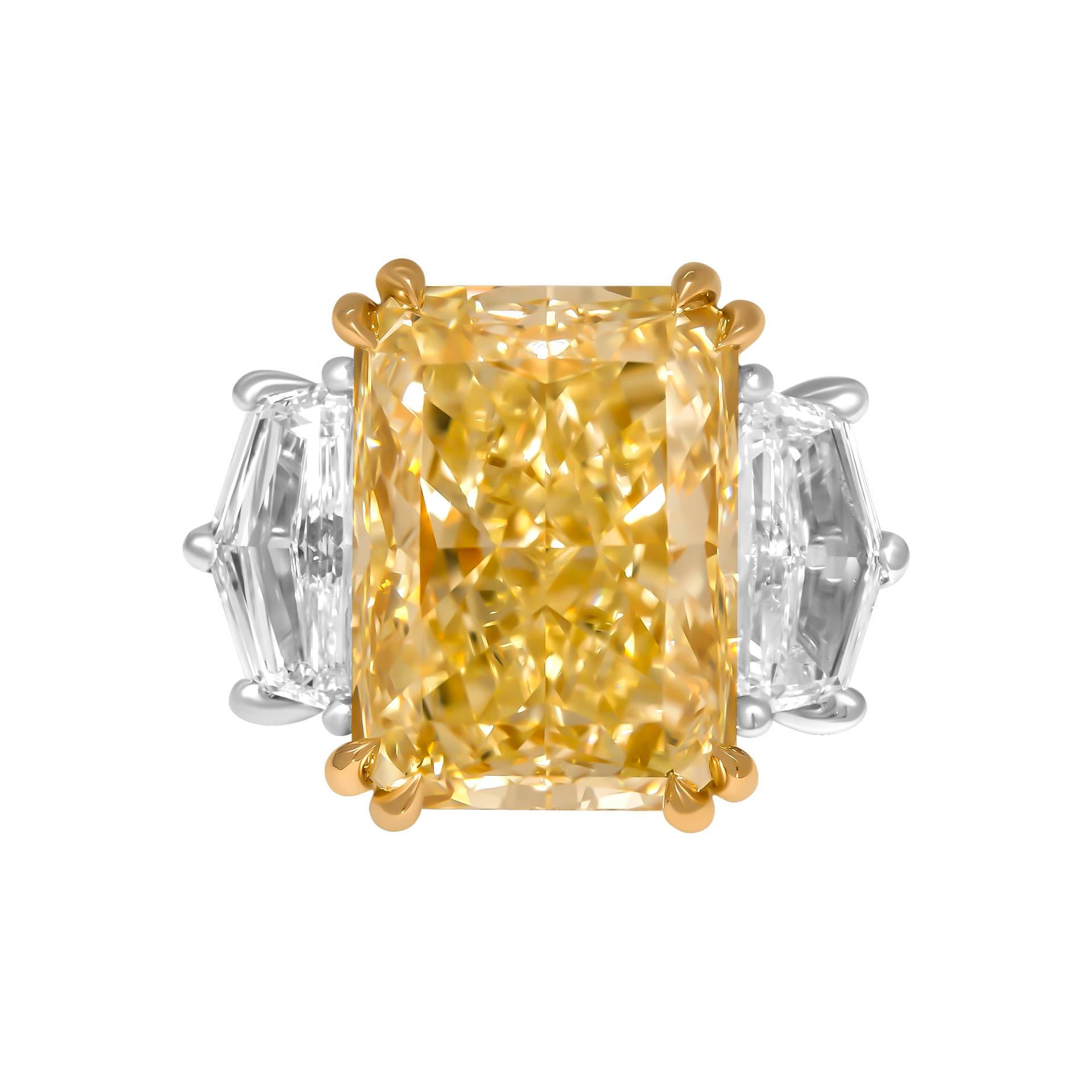 3 stone ring in Platinum & 18K Yellow Gold

Center: 11.18ct Natural Fancy Light Yellow Even VVS2 Radiant shape Diamond GIA#2225264298 

Side stones Cadillac Shape: 
1.01ct D color Flawless  GIA#1289883675
1.12 D color Internally Flawless