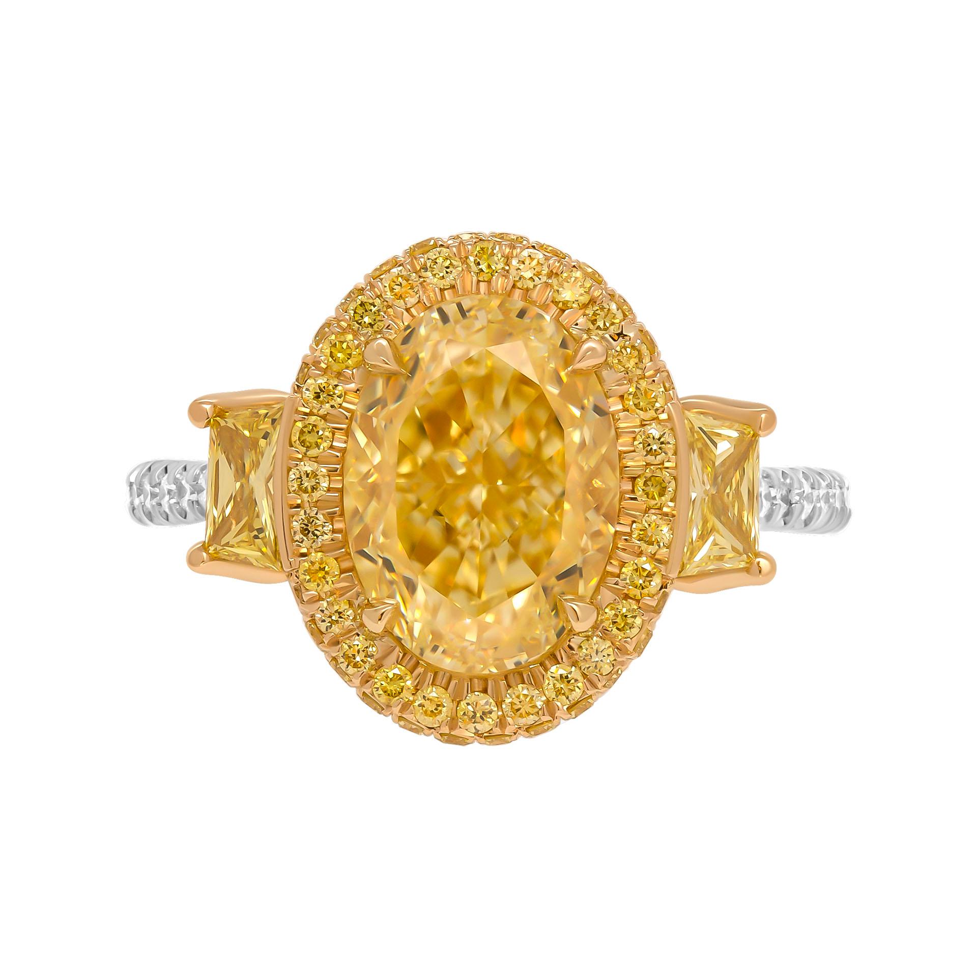 3 stone ring in Platinum & 18K Yellow Gold
Center: 3.33ct Natural Fancy Yellow VVS2 Oval Shape Diamond GIA#2446392453 

Two side trapezoids shapes diamond:
0.13ct Fancy Intense Yellow VS1 GIA#6224628782
0.13ct Fancy Intense Yellow VS1