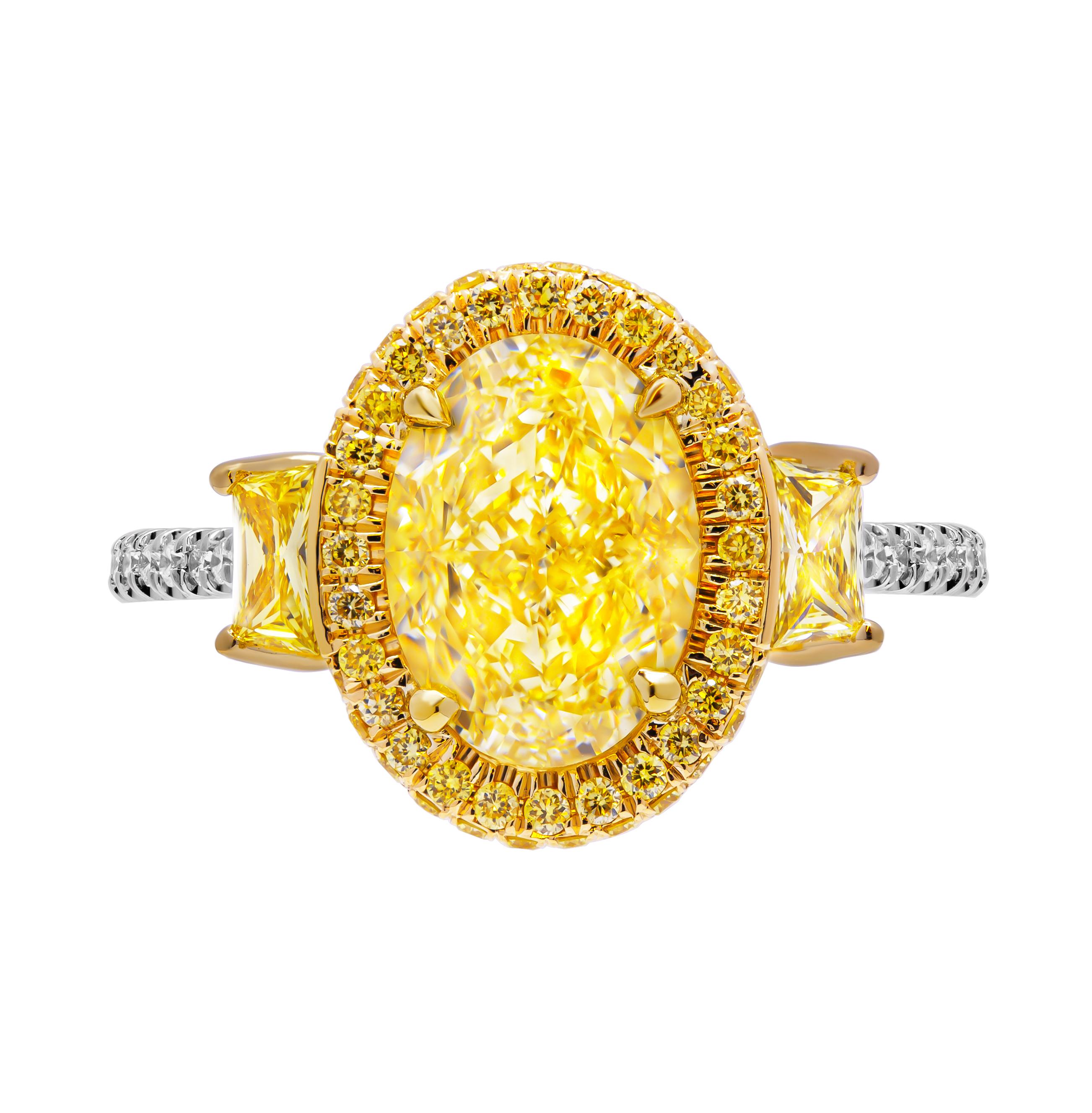 3 stone ring in Platinum & 18K Yellow Gold
Center: 3.33ct Natural Fancy Yellow VVS2 Oval Shape Diamond GIA#2446392453 

Two side trapezoids shapes diamond:
0.13ct Fancy Intense Yellow VS1 GIA#6224628782
0.13ct Fancy Intense Yellow VS1