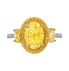 GIA Certified 3 Stone Ring with 3.33ct Fancy Yellow VVS2 Oval Diamond