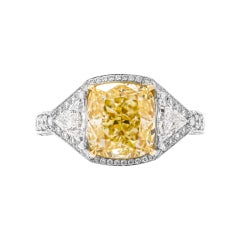 GIA Certified 3-Stone Ring with 4.01 Carat Fancy Light Yellow Diamond