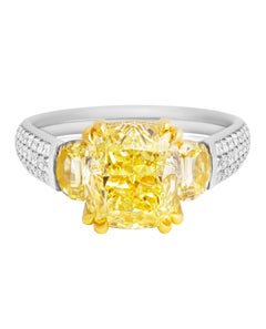 GIA Certified 3-Stone Ring with 4.04 Ct Fancy Yellow VVS2 Cushion Cut