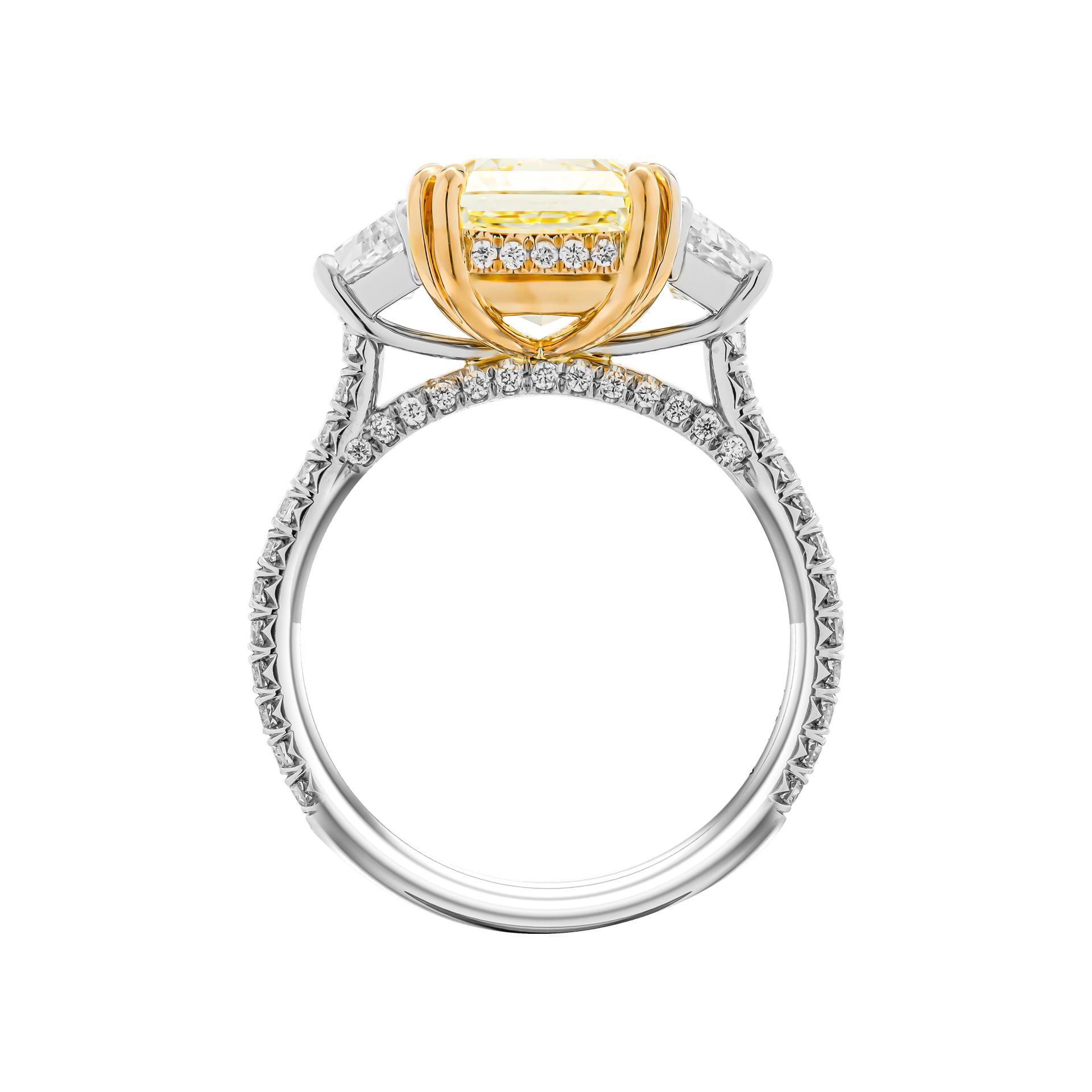 3 stone ring in Platinum & 18K Yellow Gold
Center stone: 4.50ct Natural Fancy Light Yellow Even VS1 GIA#1415233669 Radiant Shape Diamond Side stones: 0.93ct F color VS clarity 
Cathedral pave shank, gallery & bridge total carat weight of small