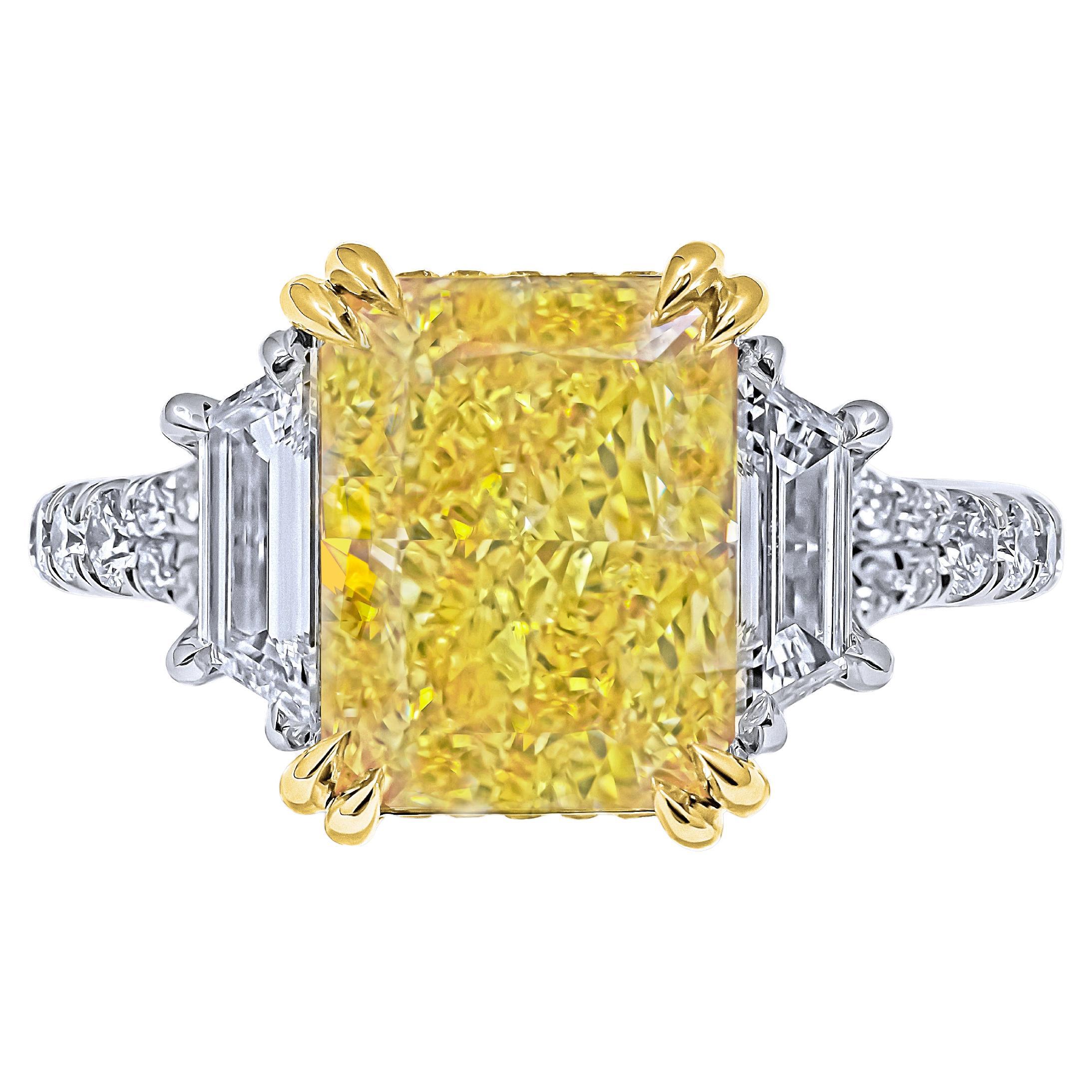 Introducing our exquisite 18K Yellow Gold and Platinum Ring, featuring a breathtaking centerpiece: a 5.02-carat Natural Fancy Intense Yellow Even SI2 Radiant Shape Diamond certified by GIA with the identification number GIA#1475020694. This