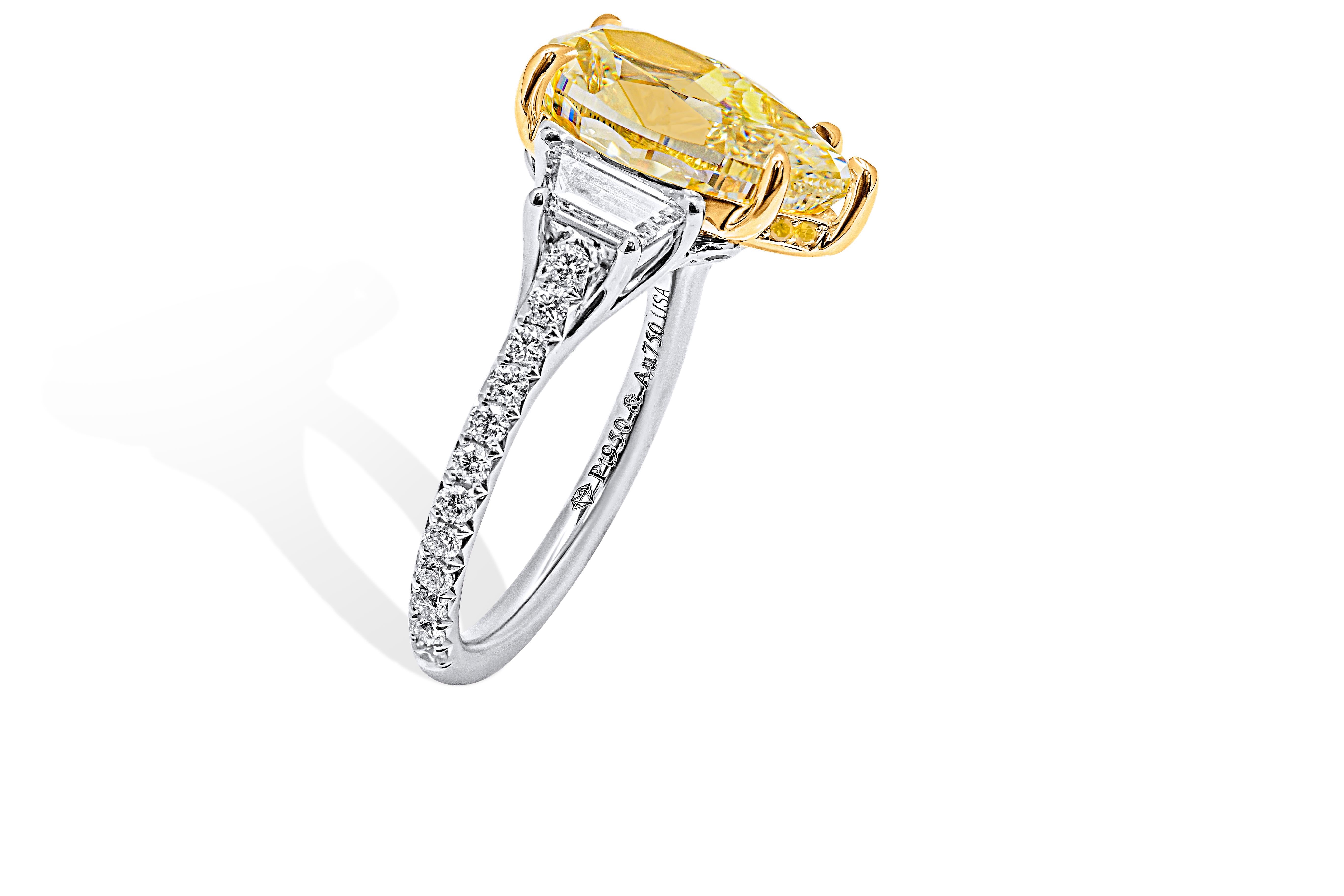 ntroducing our exquisite 3 Stone Ring in 950 Platinum and 18k Yellow Gold, a true testament to timeless elegance and sophistication. This magnificent ring boasts a stunning 5.02-carat Natural Fancy Light Yellow Even VS2 Pear Shape Diamond at its