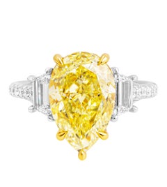 GIA Certified 3 Stone Ring with 5.02ct Fancy Light Yellow Pear Shape Diamond