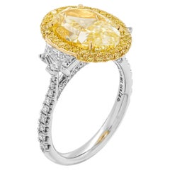GIA Certified 3-Stone Ring with 5.13ct Fancy Light Yellow VS1 Oval Diamond