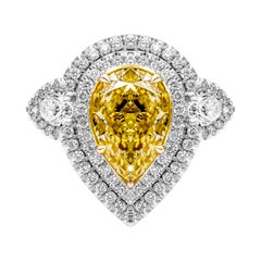 GIA Certified 3-Stone Ring with 5.27 Carat Fancy Light Yellow VS2 Pear Shape