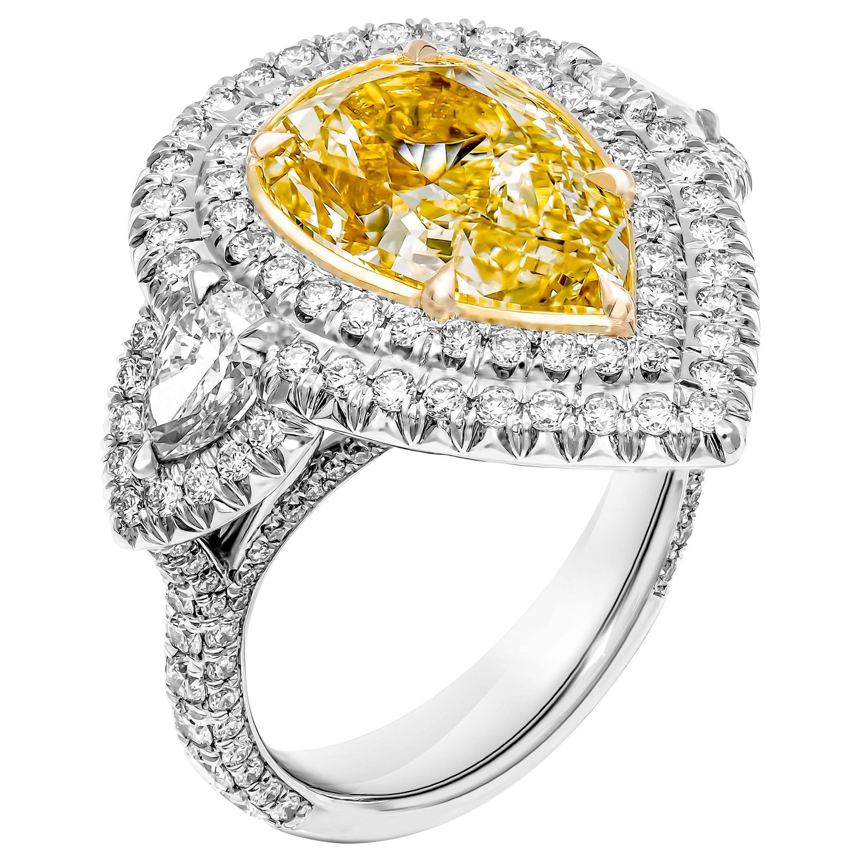 GIA Certified 3-Stone Ring with 5.27 Carat Fancy Light Yellow VS2 Pear Shape For Sale