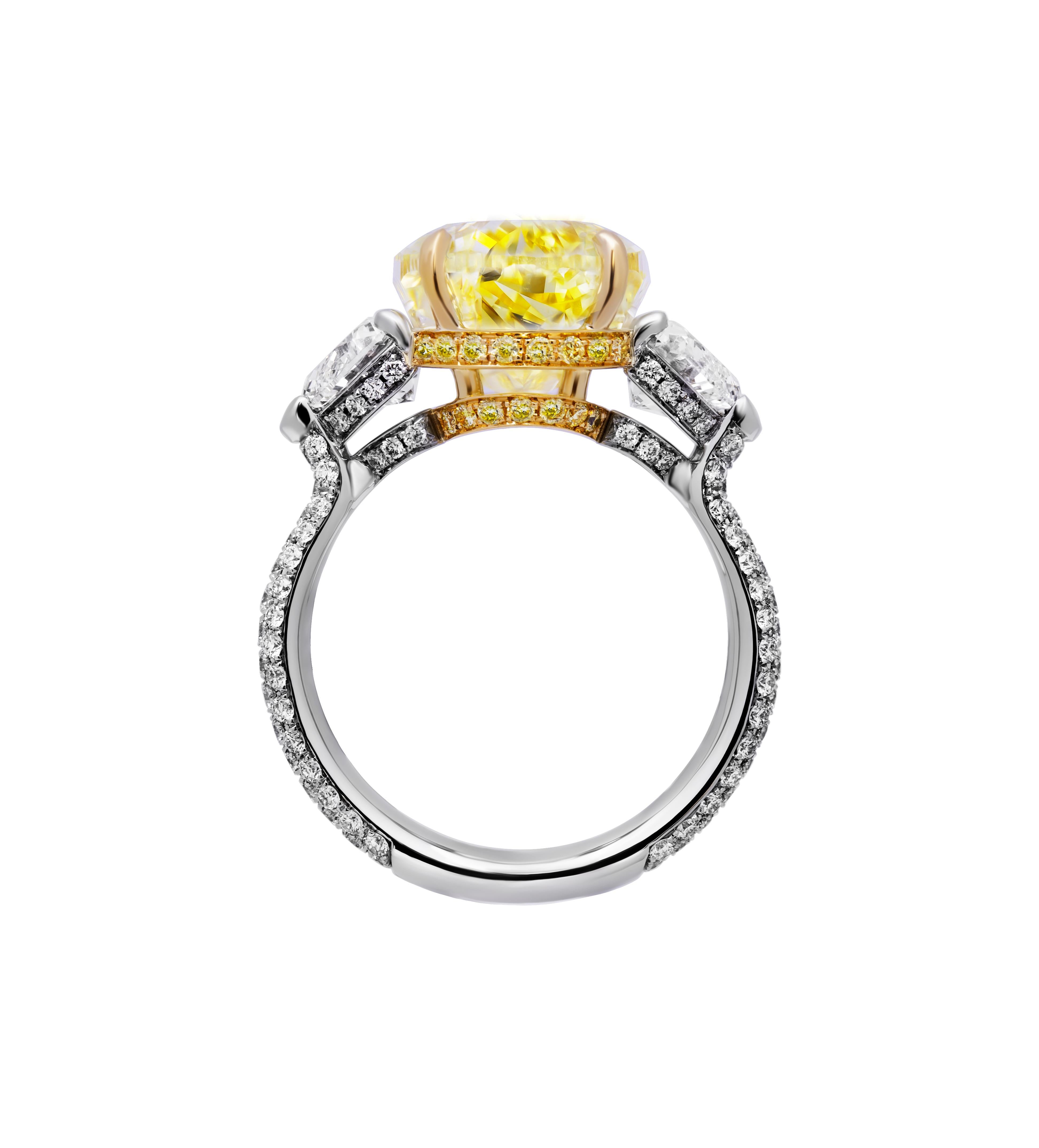 Modern GIA Certified 3 Stone ring with 7.78ct Fancy Yellow Pear Shape Diamond For Sale