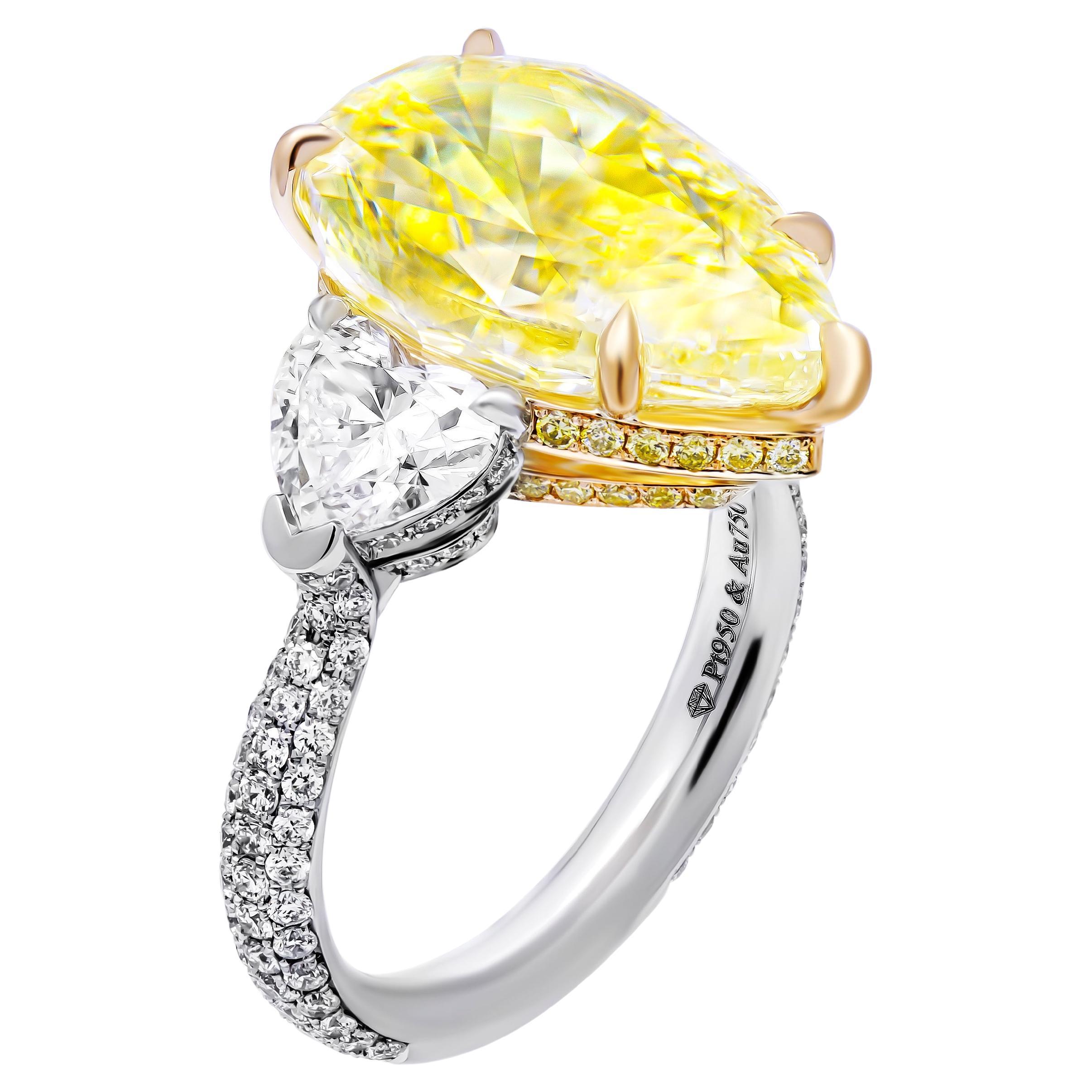 GIA Certified 3 Stone ring with 7.78ct Fancy Yellow Pear Shape Diamond For Sale