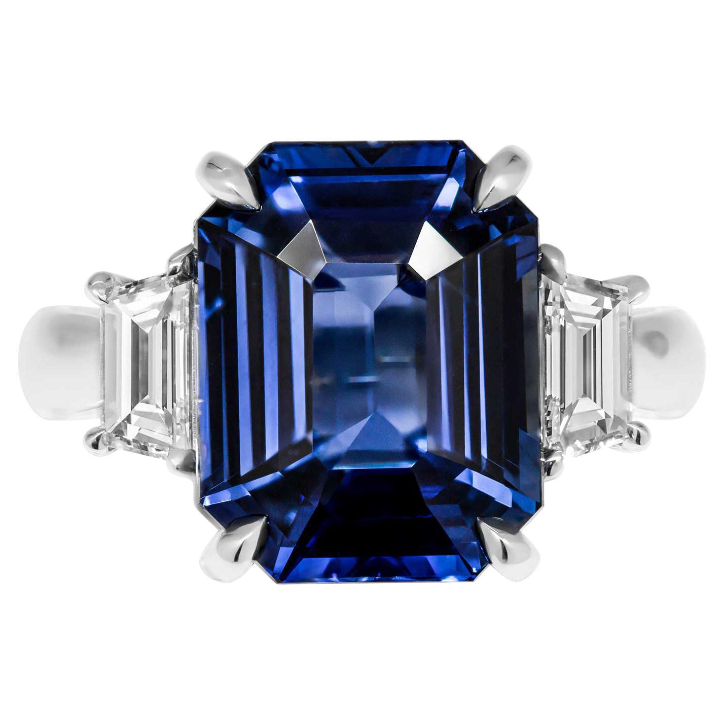 GIA Certified 3 Stone Ring with Blue Sapphire
Beautiful and elegant piece, exquisite Blue Sapphire, rich and royal blue color 
Mounted in Platinum with 2 trapezoid side stones totaling 0.6ct F-G VVS 
Center stone is 9.11ct Emerald Cut Blue Sapphire