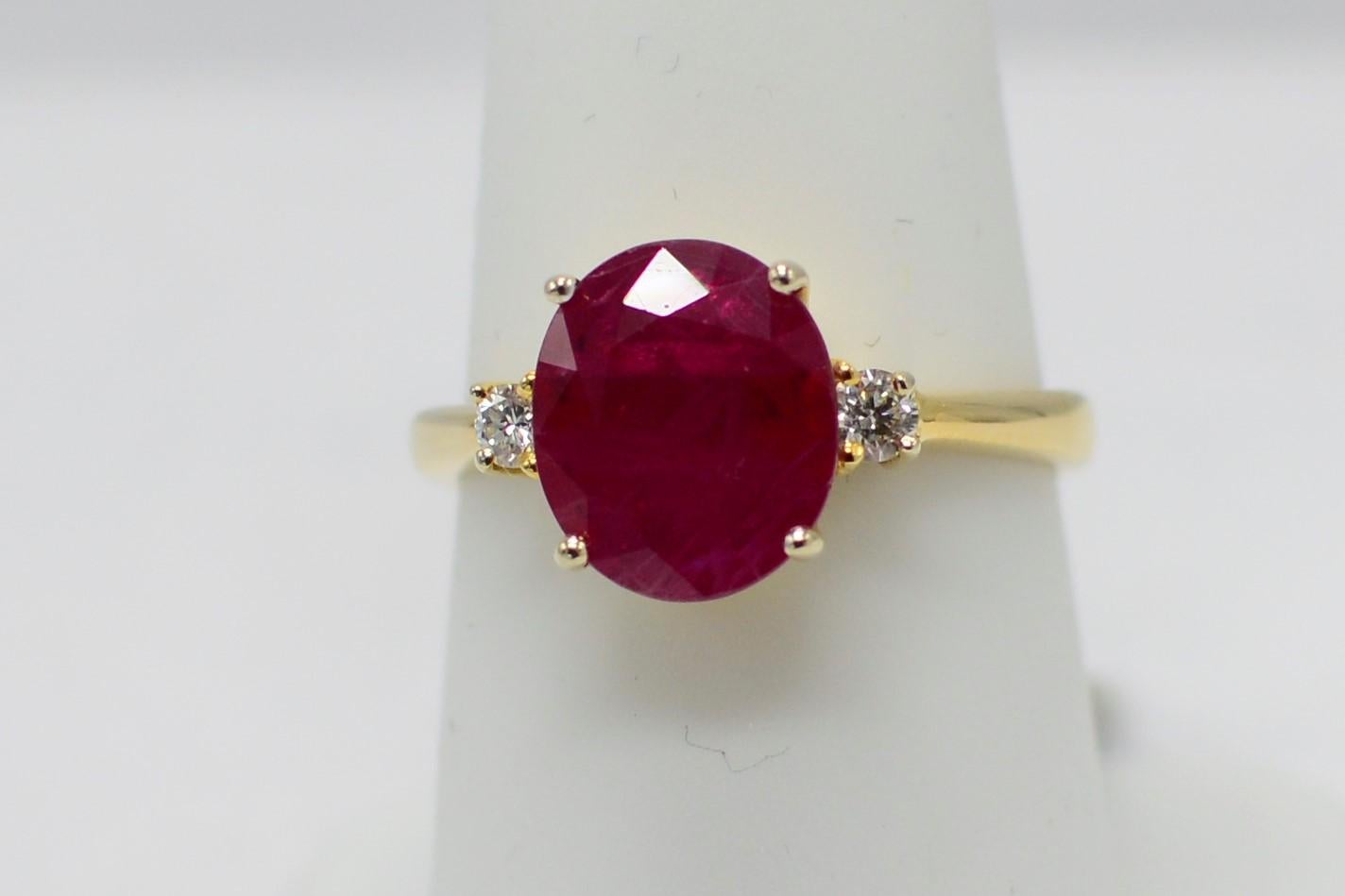 GIA Certified natural Burma 3.0 carat Ruby ring in 18K Yellow Gold, with side two round diamond 0.10 carat. Diamonds are G-H color VVS quality. this Burma Ruby is very deep red in color and with good luster.
oval shape Ruby.
18k yellow gold  3.80