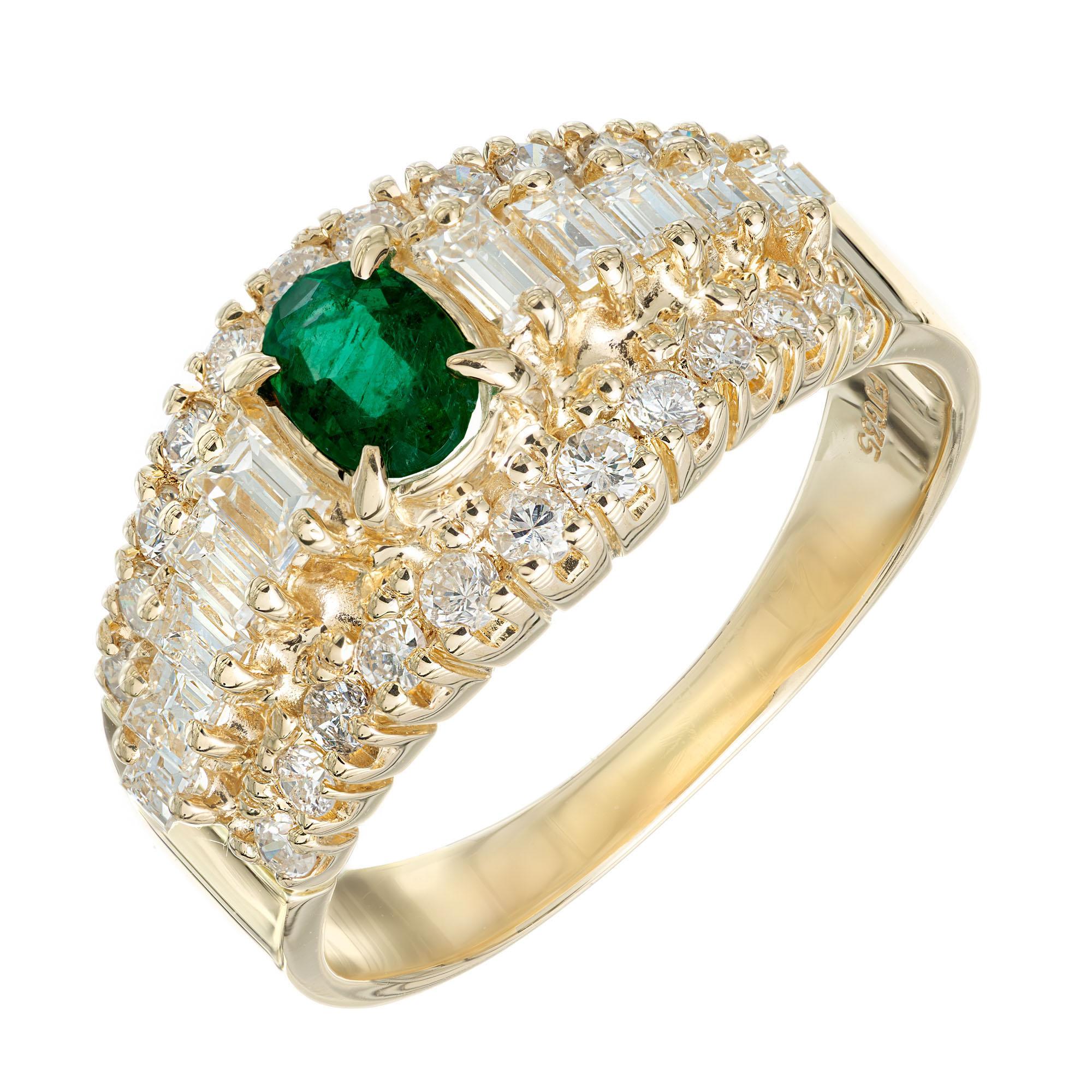 Emerald and diamond engagement ring. GIA certified oval green emerald center stone in a 14k yellow gold dome setting with 10 baguette and 22 round brilliant cut diamonds. 

1 oval green emerald, SI approx. .30cts GIA Certificate # 1216379506
10