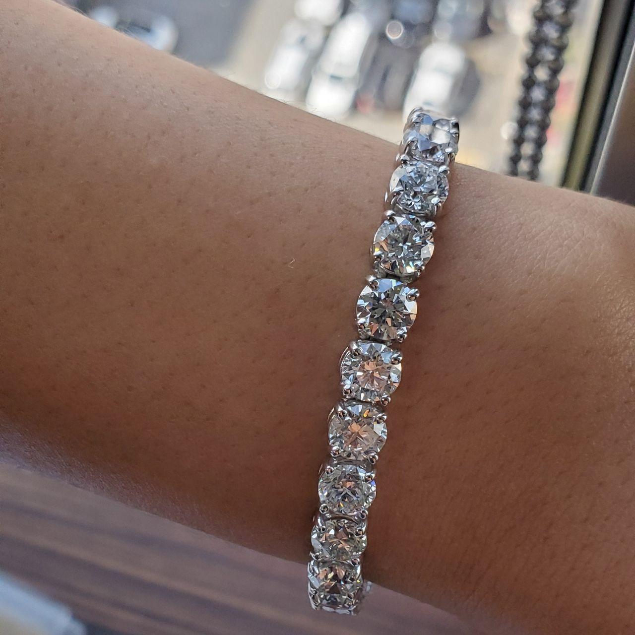 Four Prong 25CT TW Natural Diamond Tennis Bracelet in Platinum Natural Diamonds: Round shape, I color, SI clarity. Setting: 4 Prong. All diamonds come with GIA certificates