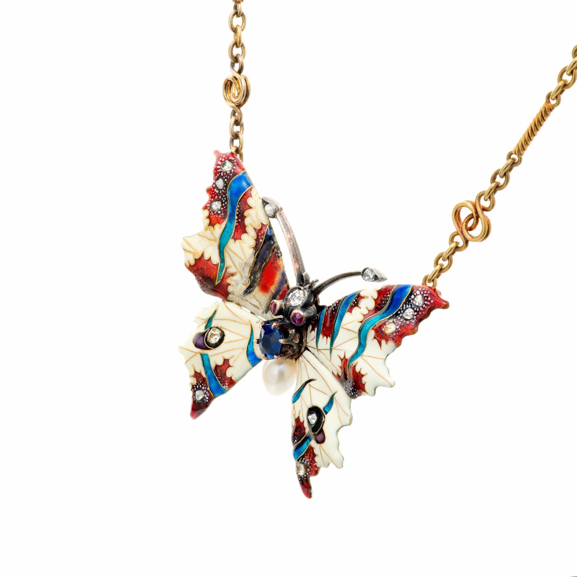 Diamond, pearl and sapphire butterfly pendant necklace. GIA certified natural no heat blue sapphire accented with natural peal, genuine ruby and old mine cut diamond accents. White, blue and red enamel. 17 inches long. Natural patina on this