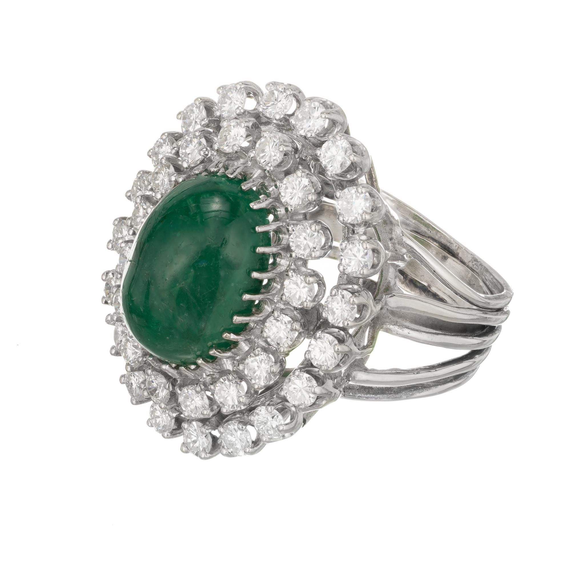 Mid-Century GIA certified 3.00 carat cabochon emerald and diamond cocktail ring. Moderate inclusions, Natural color F1 ( low level) clarity enhanced with two rows of full cut accent diamonds in a 14k white gold setting. Circa 1960

1 oval cabochon