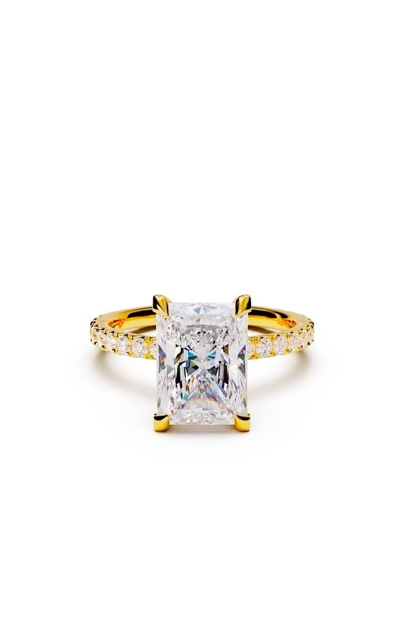Some designs speak for themselves -pure brilliance, flawless balance , and effortlessly sophistication.
Crafted under the discerning eye of jewelry designer, this radiant -cut diamond is set in refined eagle claws, each delicately pavè-set with