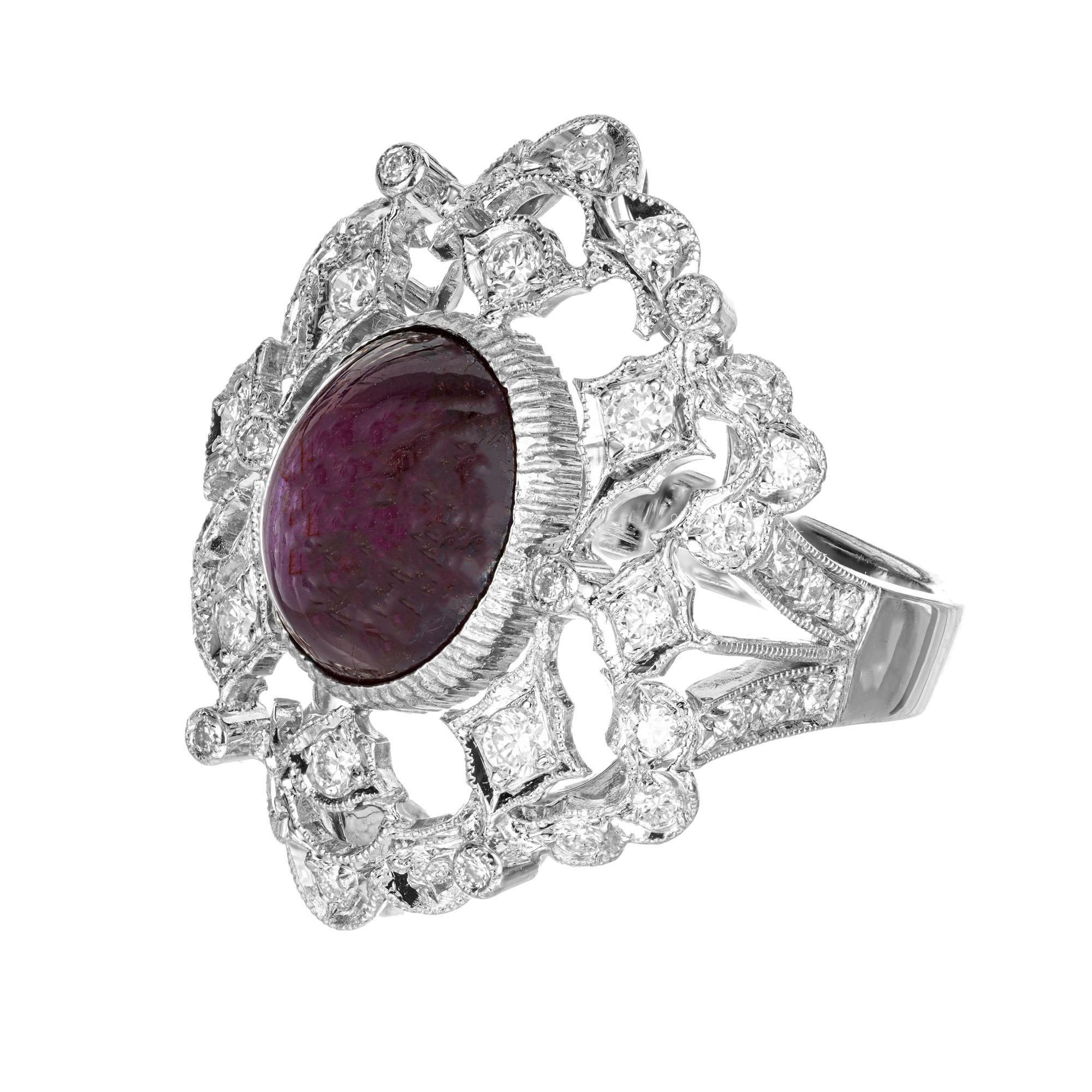 1950's Ruby and diamond cocktail ring. GIA certified cabochon oval center natural, no heat ruby set in a open work 18k white gold setting with 44 round accent diamonds. 

1 oval cabochon purplish red star Ruby, approx. total weight 3.00cts, 10.52 x