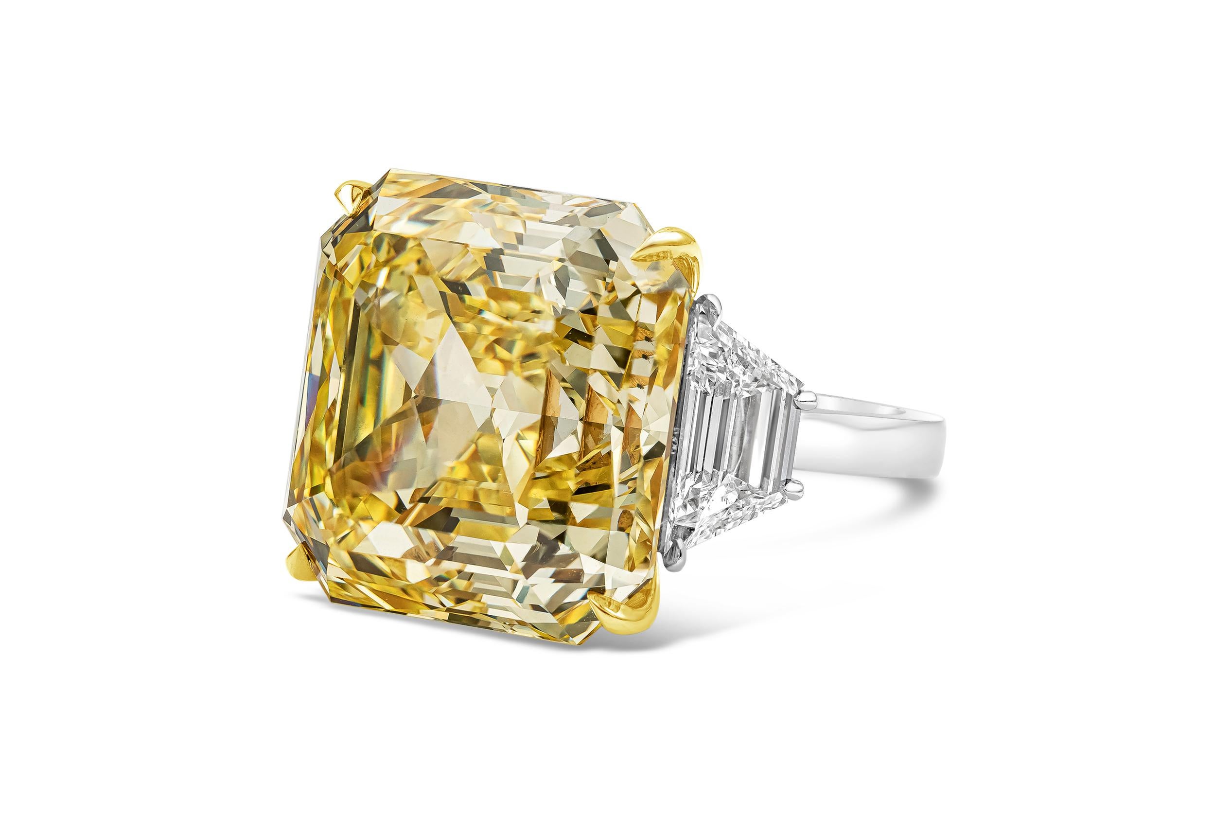 A very rare piece of jewelry that will catch everyone's eye. Features a stunning 30.02 carat asscher cut diamond that GIA certified as fancy intense yellow color and VVS2 clarity. Elegantly set in an 18k yellow gold basket, the center stone is