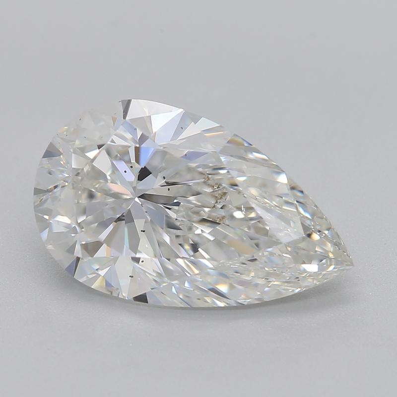 Handcrafted in New York, a stunning diamond ring that embodies elegance and charm, featuring a mesmerizing pear diamond of 3.01 , graded G and SI1. This exquisite piece showcases an asymmetrical halo crafted from smaller diamonds, intricately