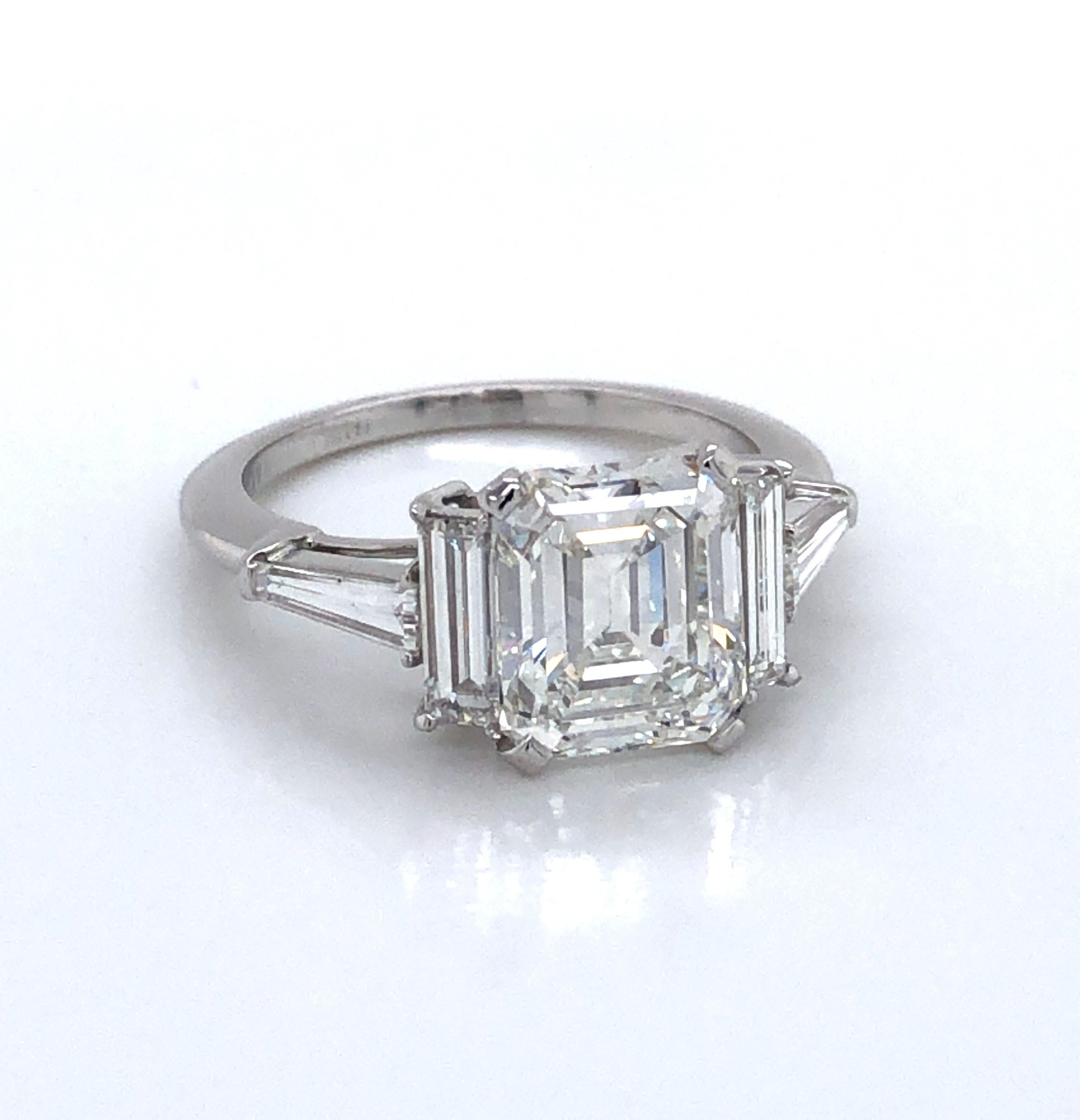 Undeniably spectacular and sure to get her attention, this 3.01 carat emerald cut diamond engagement ring is beautifully set in platinum and highlighted by two .04 carat diamond baggets. 
Boasting a 3.01  carat GIA certified emerald cut diamond
