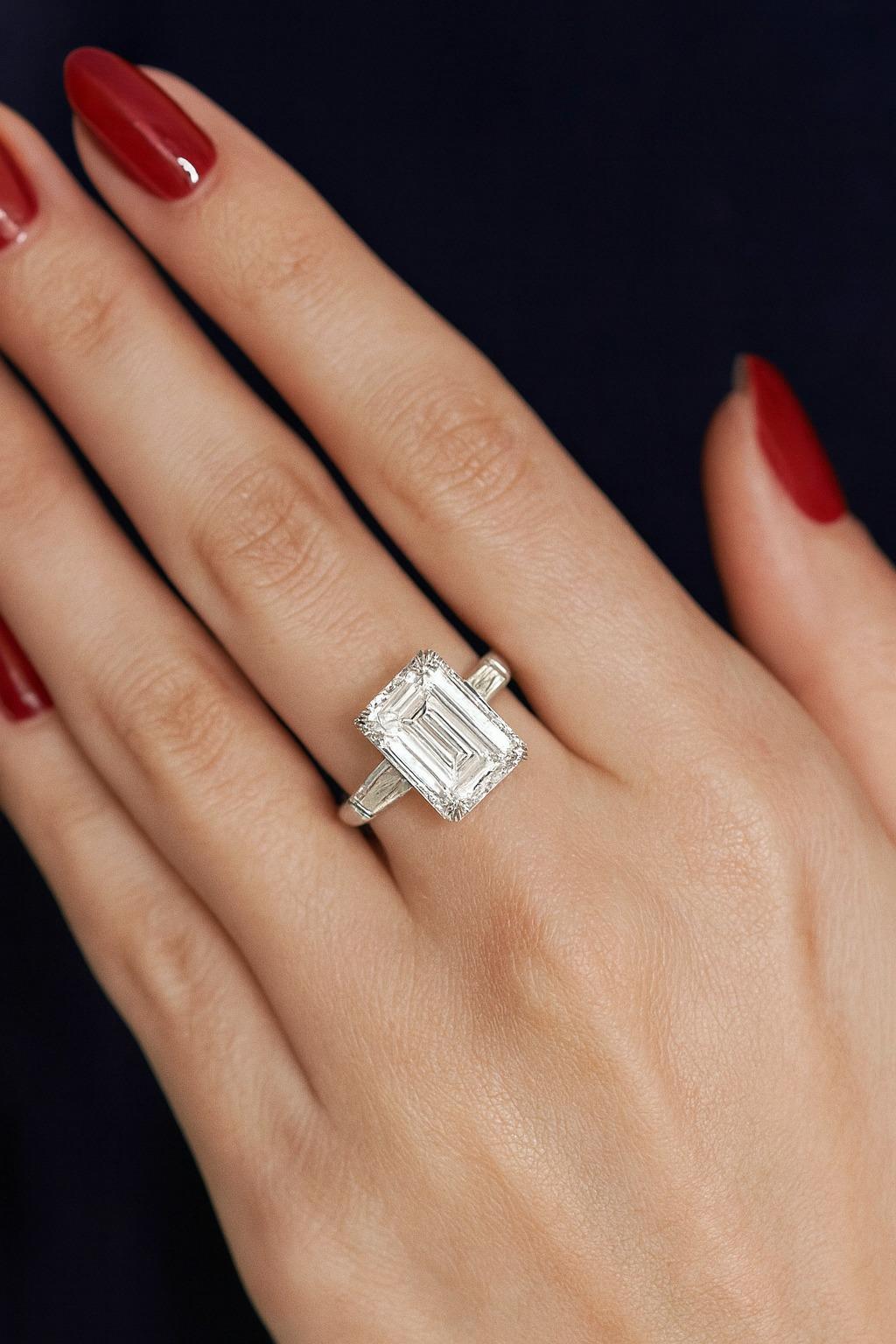 GIA Certified 3.01 Carat Emerald Cut Diamond Platinum Ring with Tapered Baguettes

An elegant platinum ring centered with a GIA Certified 3.01 Carat Emerald Cut Diamond, graded G Color, VS1 Clarity with Excellent Polish, Very Good Symmetry, and