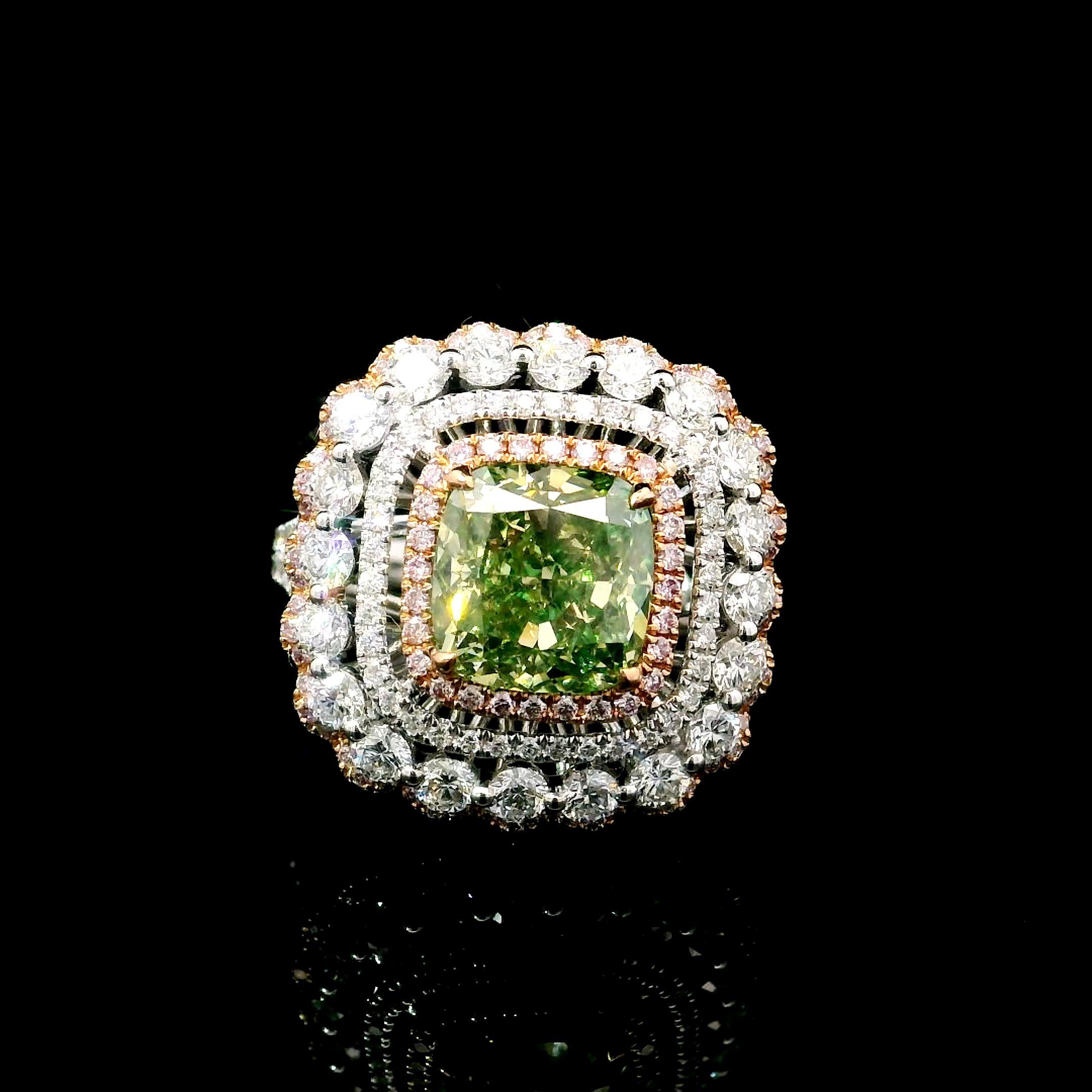 18kt white gold ring with diamonds
  
  Gold colour & karat: White gold 18kt
  Weight: 4.70 grams
  
  Set with-
  Stone type: Diamonds
  Shape: Cushion
  Carat: 3.01 ct
  Colour: Fancy Brownish Greenish Yellow
  Clarity: SI2
  
  Surrounding