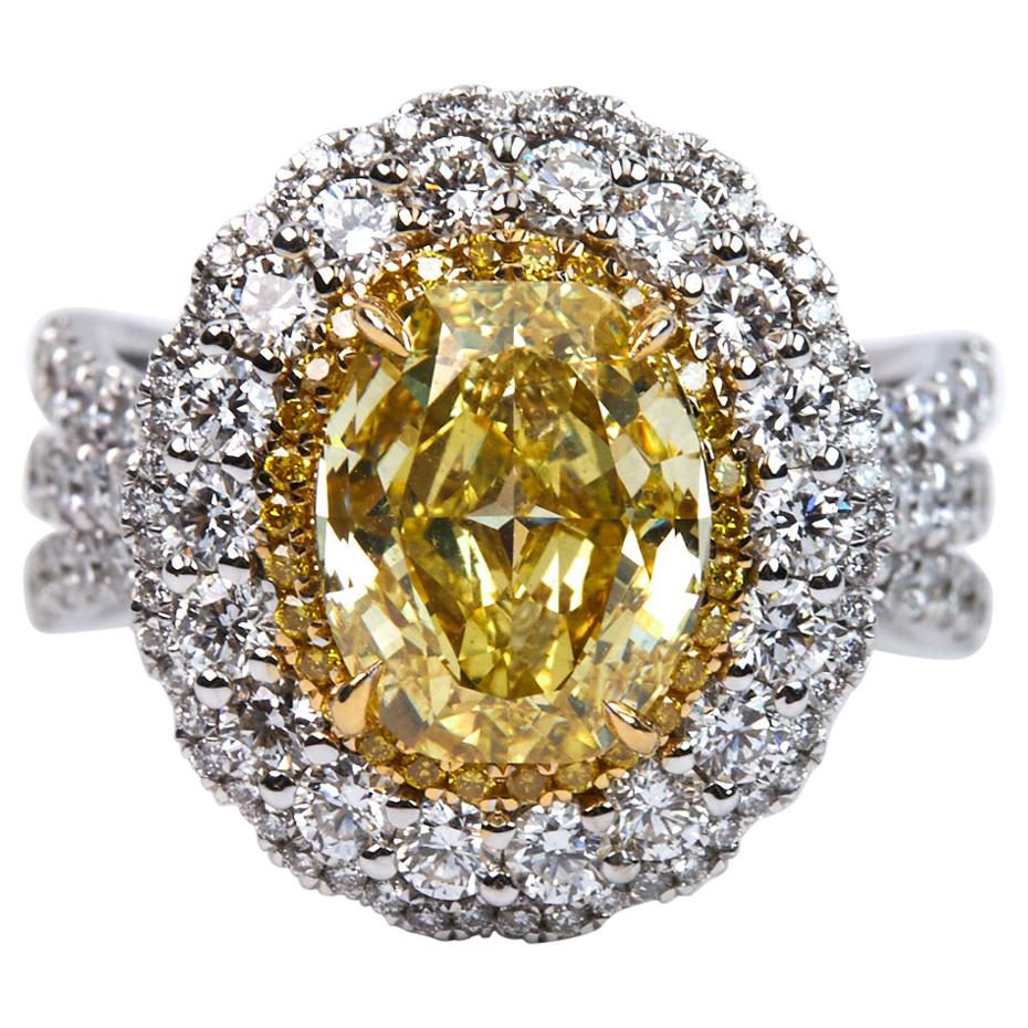 GIA Certified 3.01 Carat Fancy Intense Yellow Oval Cut Diamond Ring For Sale