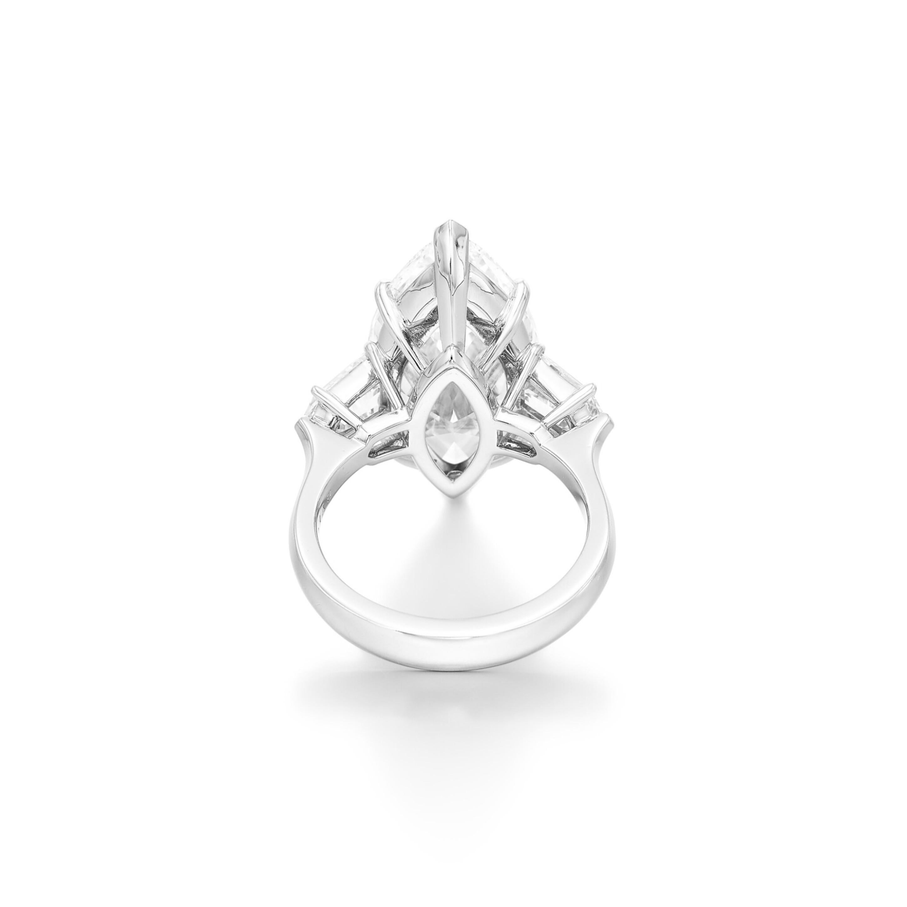 This stunning engagement ring features a 3.01-carat marquise cut diamond as its centerpiece, exuding elegance and timeless beauty. Crafted in platinum, the ring offers both durability and luxury. 

Certified by GIA, the diamond boasts a D color