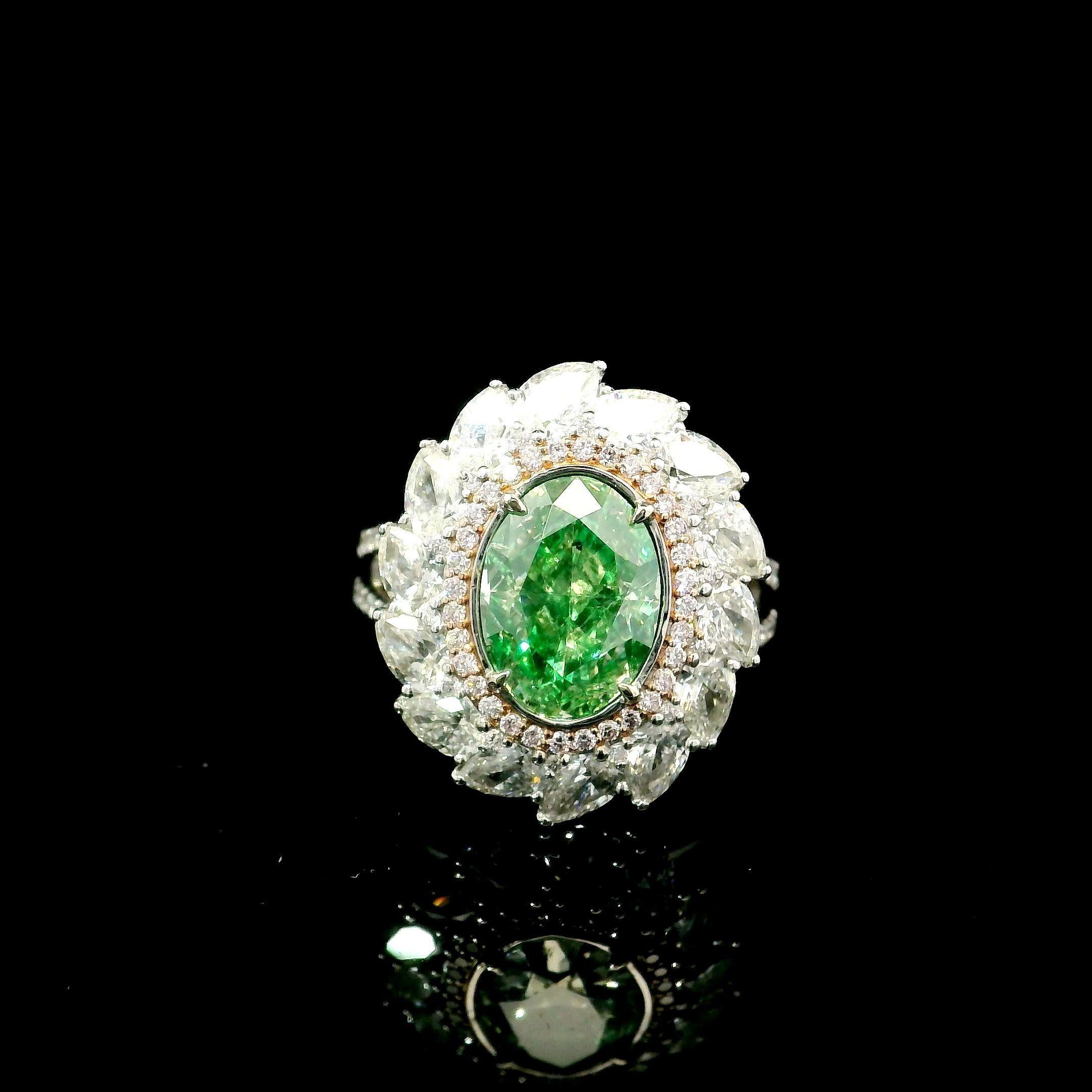 18kt white gold ring with diamonds
  
  Gold colour & karat: White gold 18kt
  Weight: 8.46 grams
  
  Set with-
  Stone type: Diamonds
  Shape: Oval
  Carat: 3.01 ct
  Colour: Fancy Light Brownish Greenish Yellow
  Clarity: I1
  
  Surrounding