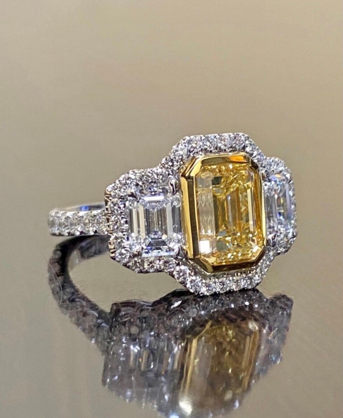 GIA Certified 3.02 Carat Emerald Cut Fancy Yellow Diamond Engagement Ring For Sale 4