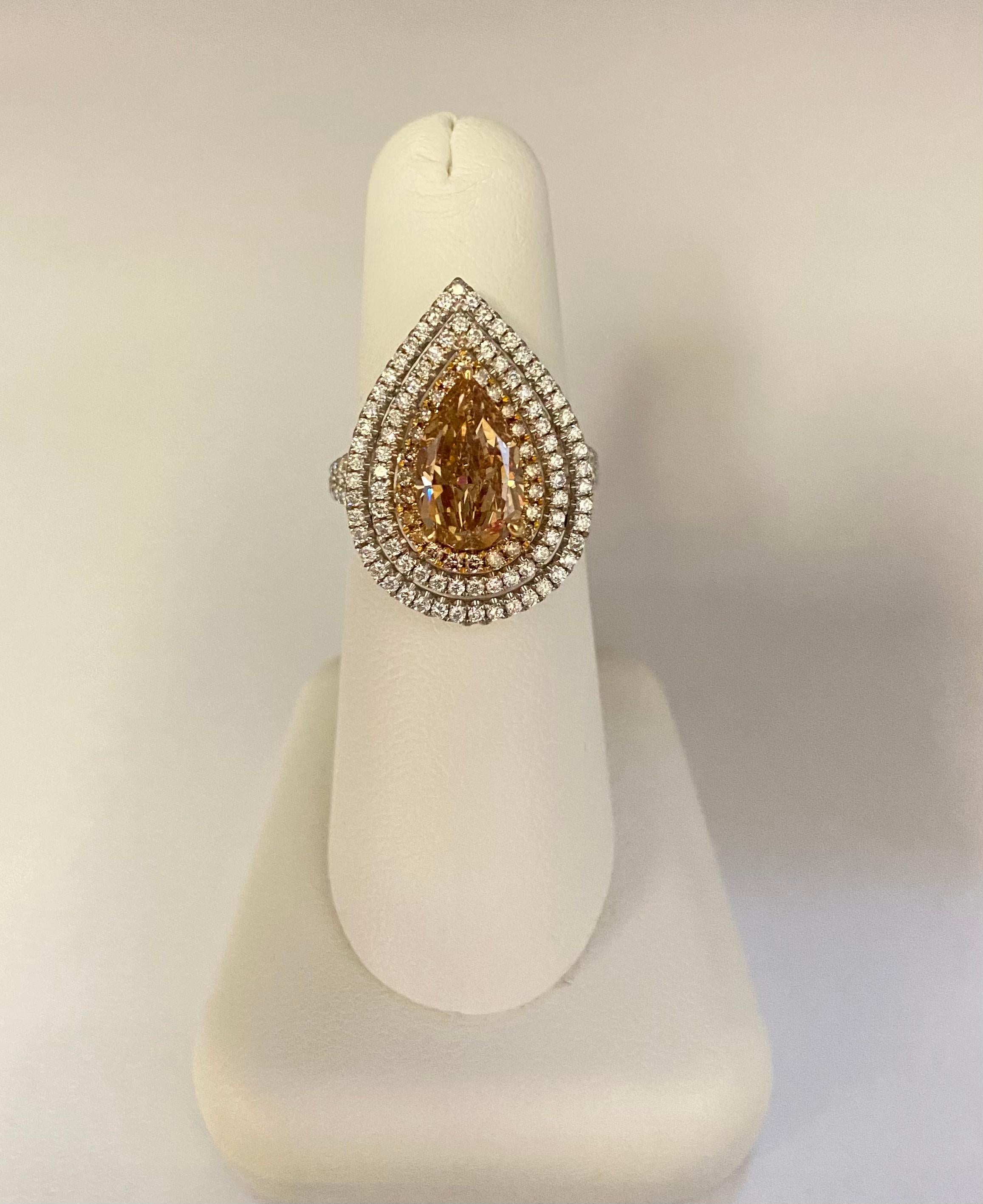 Handmade 18k White & Rose gold micro-pave ring with GIA certified rare pear shape cut diamond of Fancy Brown-Orange diamond color & SI2 clarity, size 7.  
The ring is made of 2 rows of natural round brilliant cut white diamonds and 1 row of natural