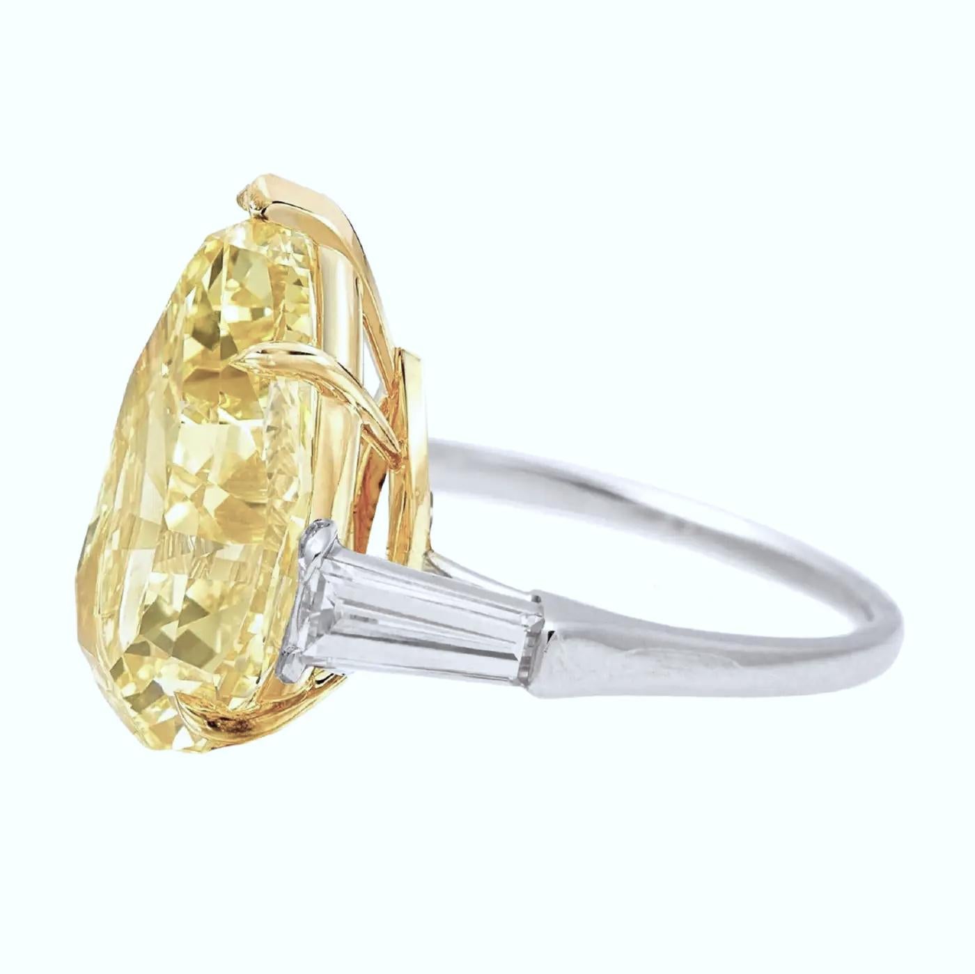 Contemporary GIA DOR Certified 3.45 Carat Pear Cut Diamond Fancy Yellow Three Stone Ring For Sale