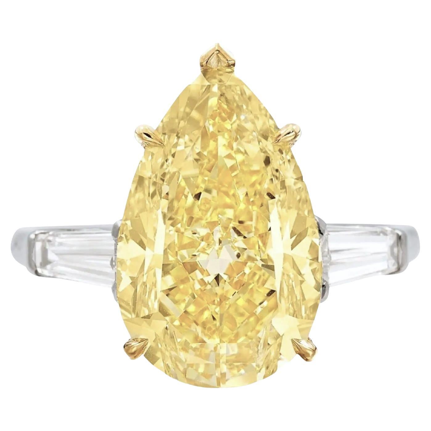 GIA DOR Certified 3.45 Carat Pear Cut Diamond Fancy Yellow Three Stone Ring For Sale