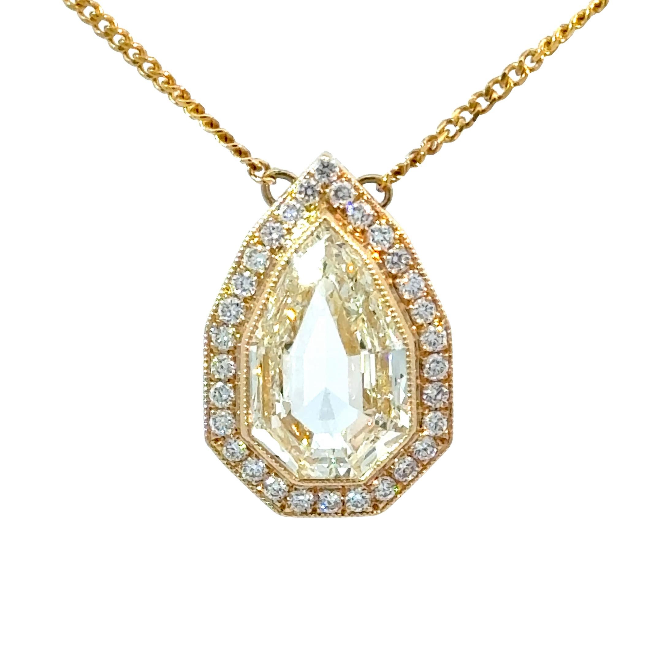 A modern natural GIA certified Pear Step Cut diamond with an Art Deco style cut.
Center stone weight 3.02 Carat. Light Yellow Color with a beautiful spread of 13.03 x 7.97 mm.
Set in a 18kt Yellow Gold hand made pendant with bezel Millgrainand 0.30
