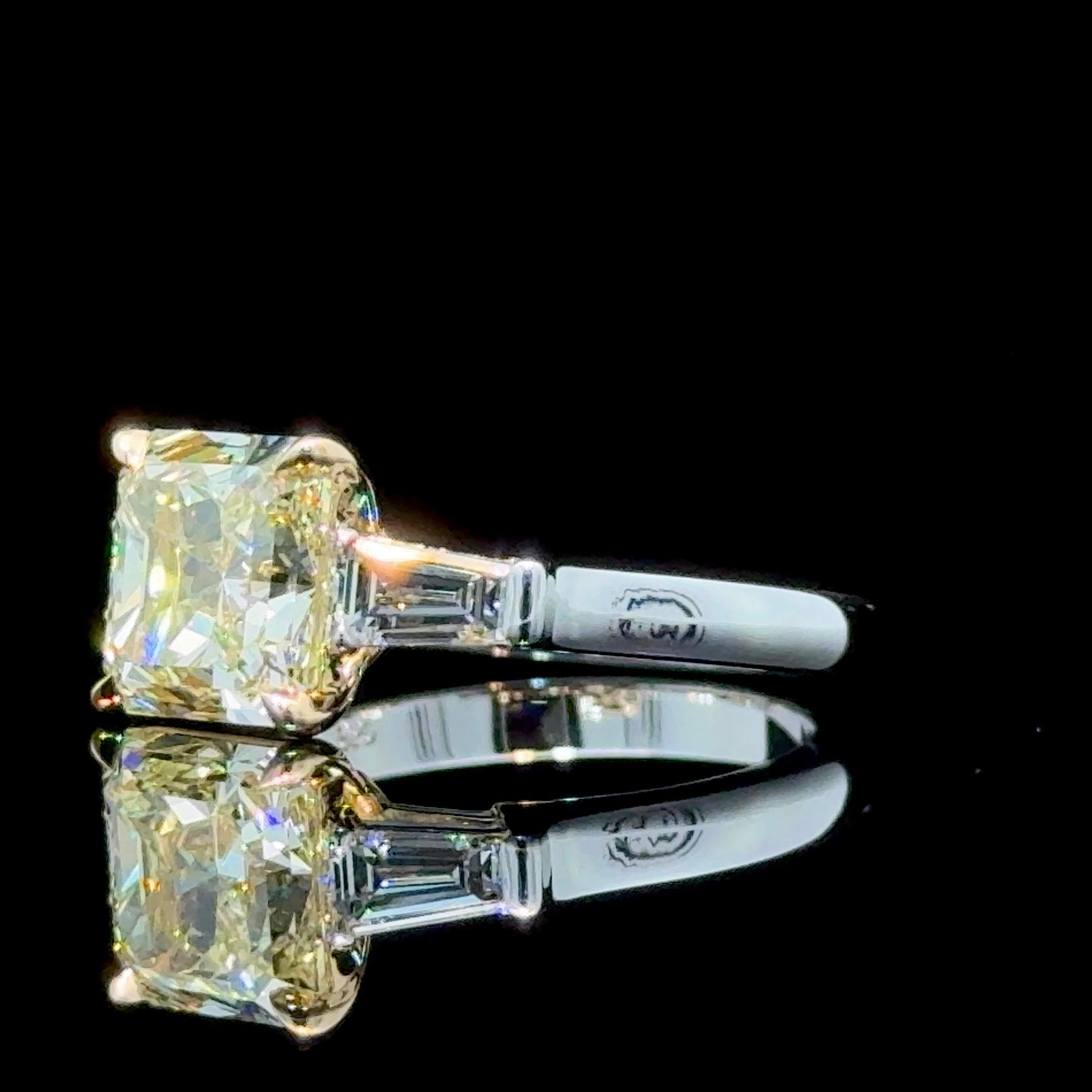 GIA Certified 3.03 Carat Radiant Cut Yellow Diamond 3 Stone Ring In New Condition For Sale In New York, NY