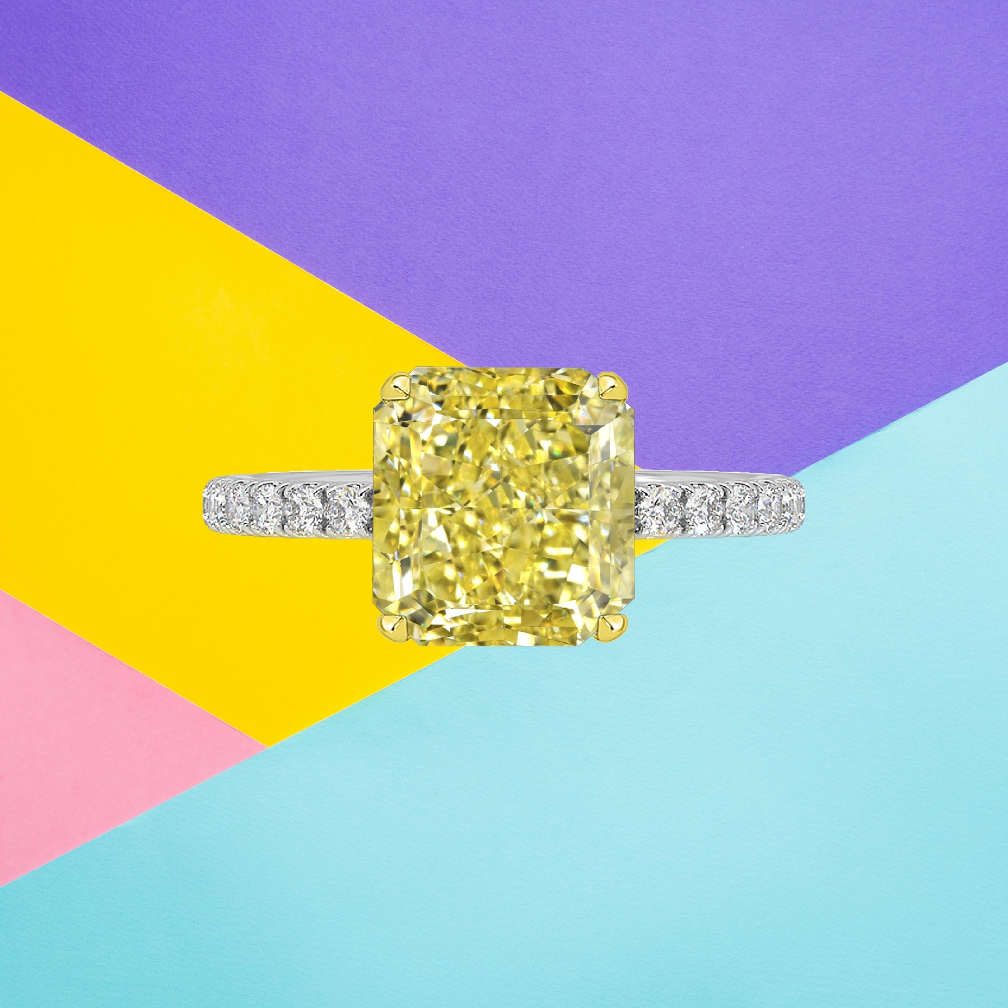 This radiant cut diamond weighs 3.03 carat and is certified 'Fancy Intense Yellow' color by the Gemological Institute of America. The GIA has also assigned a VS2 clarity grading to the stone. The diamond has been inscribed with the certificate