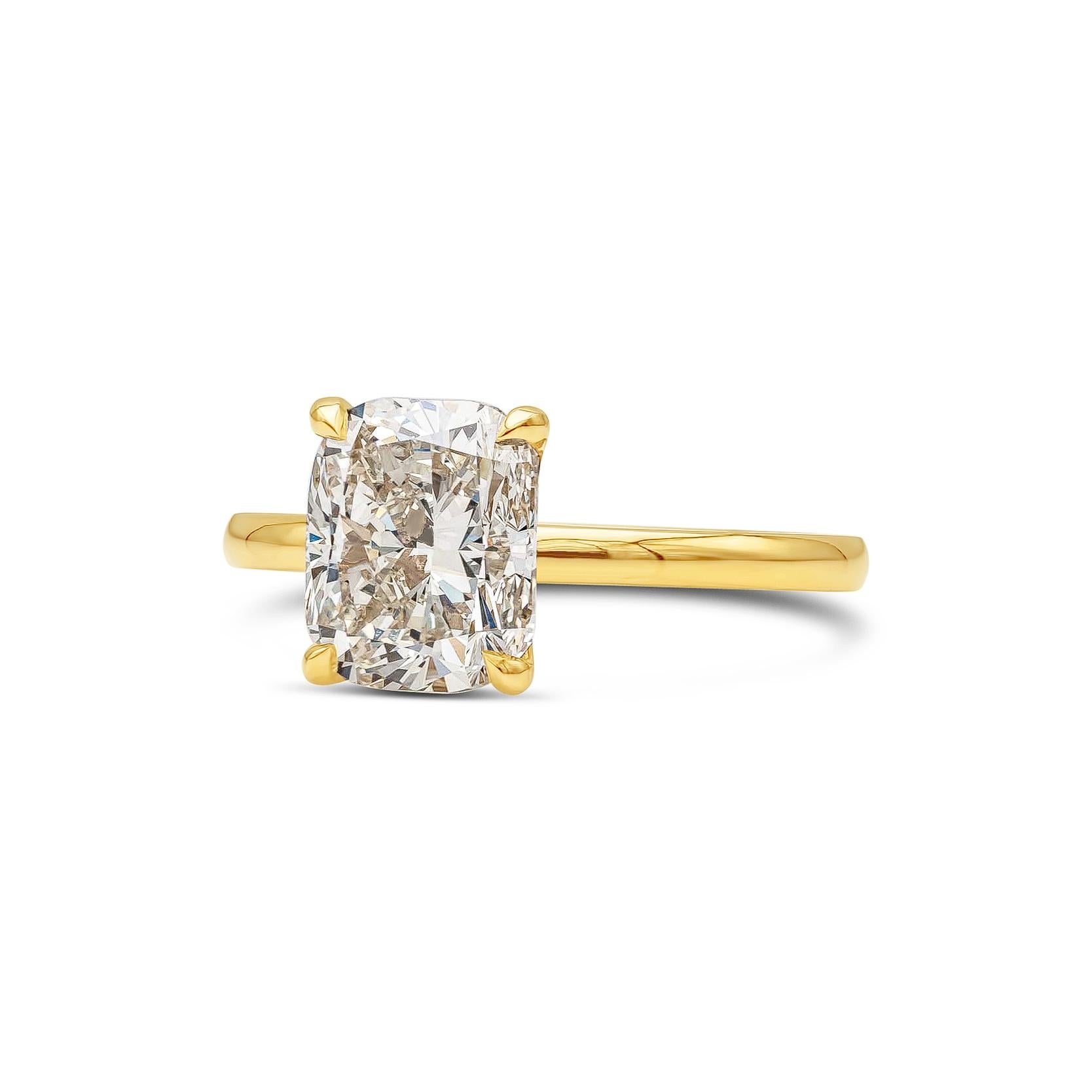 A simple and classic solitaire engagement ring style showcasing a GIA Certified 3.04 carat cushion cut diamond, N Color and VVS2 in Clarity. 4 prong set in a thin band. Made with 18K Yellow Gold. Size 6 US

Style available in different price ranges.
