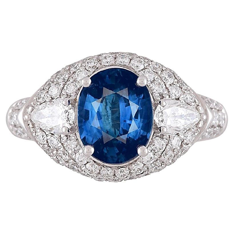 Showcasing a GIA Certified 3.04 carat oval-cut Ceylon sapphire at its core, and adorned with 1.19 carats of white diamonds, this ring radiates brilliance from every vantage point. The intricate hand-engraved milgrain work that adorns the piece