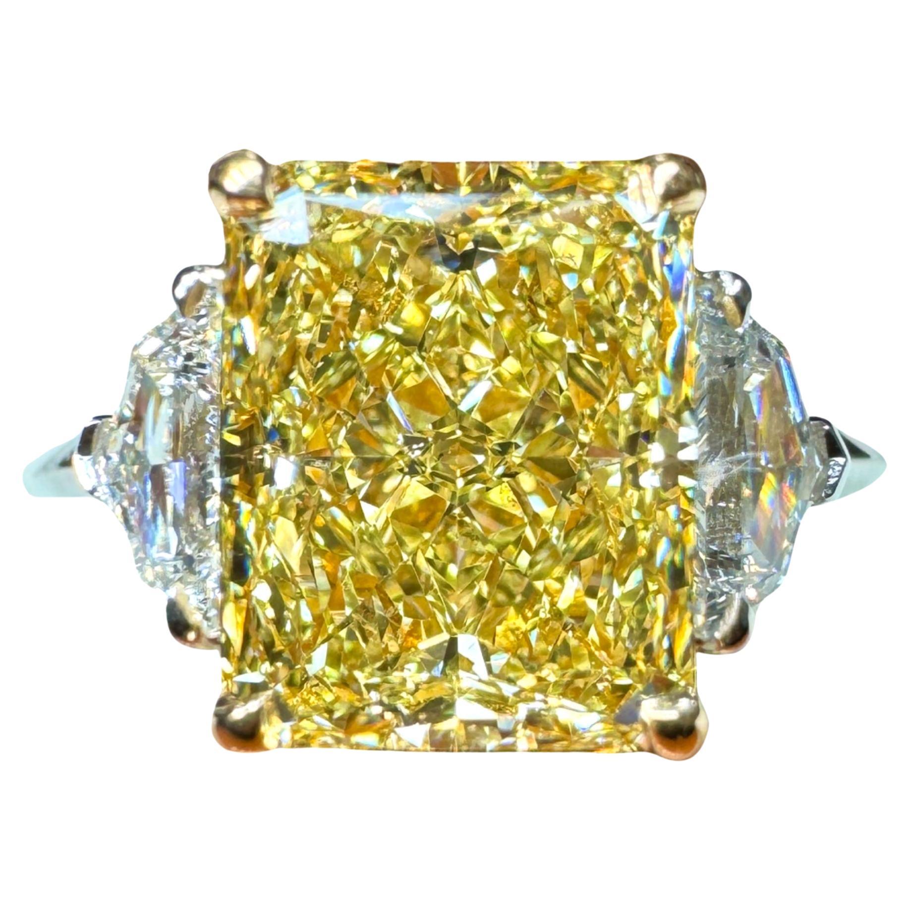 GIA Certified 3.04 Carat Radiant Cut Fancy Yellow Diamond Three Stone Ring For Sale