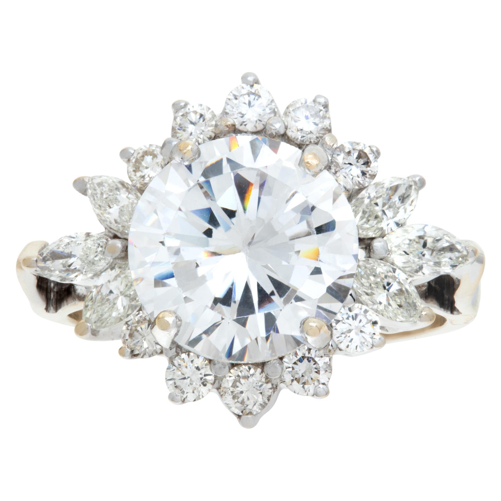GIA certified round brilliant cut diamond 3.04 carat ( D color, SI2 clarity) ring mounted in an 18k white and yellow gold setting with approximately 0.75 carats in round and marquise diamonds. Size 6.5.This GIA certified ring is currently size 6.5