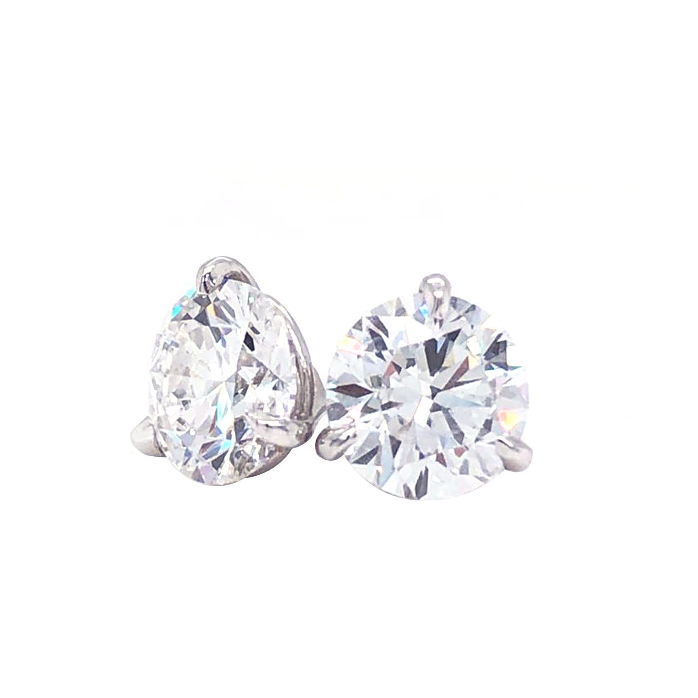 These stunning earrings are bound to sweep your girl off her feet. The diamonds have a total weight of 1.52 carat in weight, have a VS2 enhanced purity and a E in color. The diamonds are set in a beautiful and timeless 14 karat solid white gold