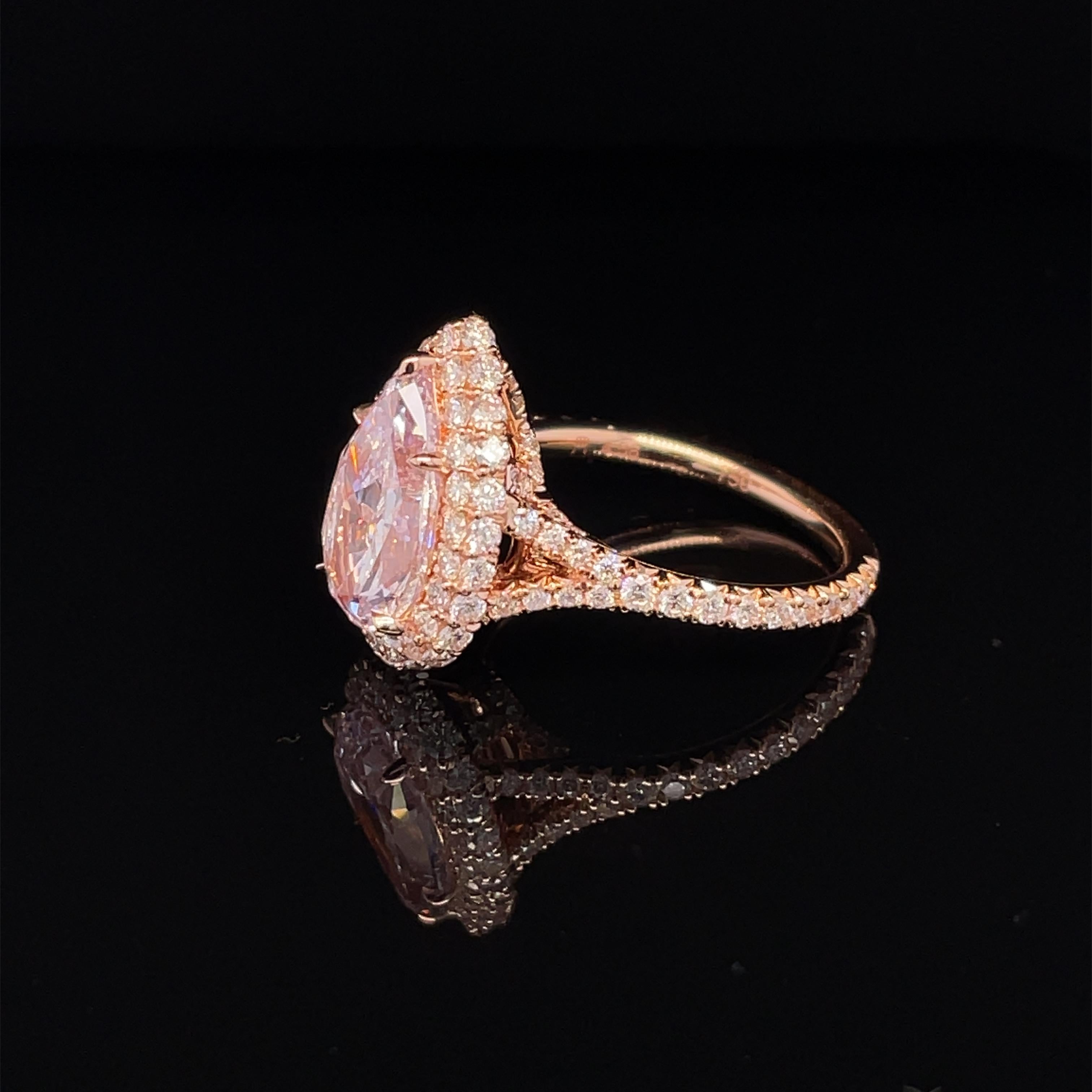 This beautiful 3.04ct natural Light Pink Diamond is 18K Rose gold halo diamond ring set with + 110 PSC Round diamonds = 1.27cttw
GIA Certificate#5211824625 


