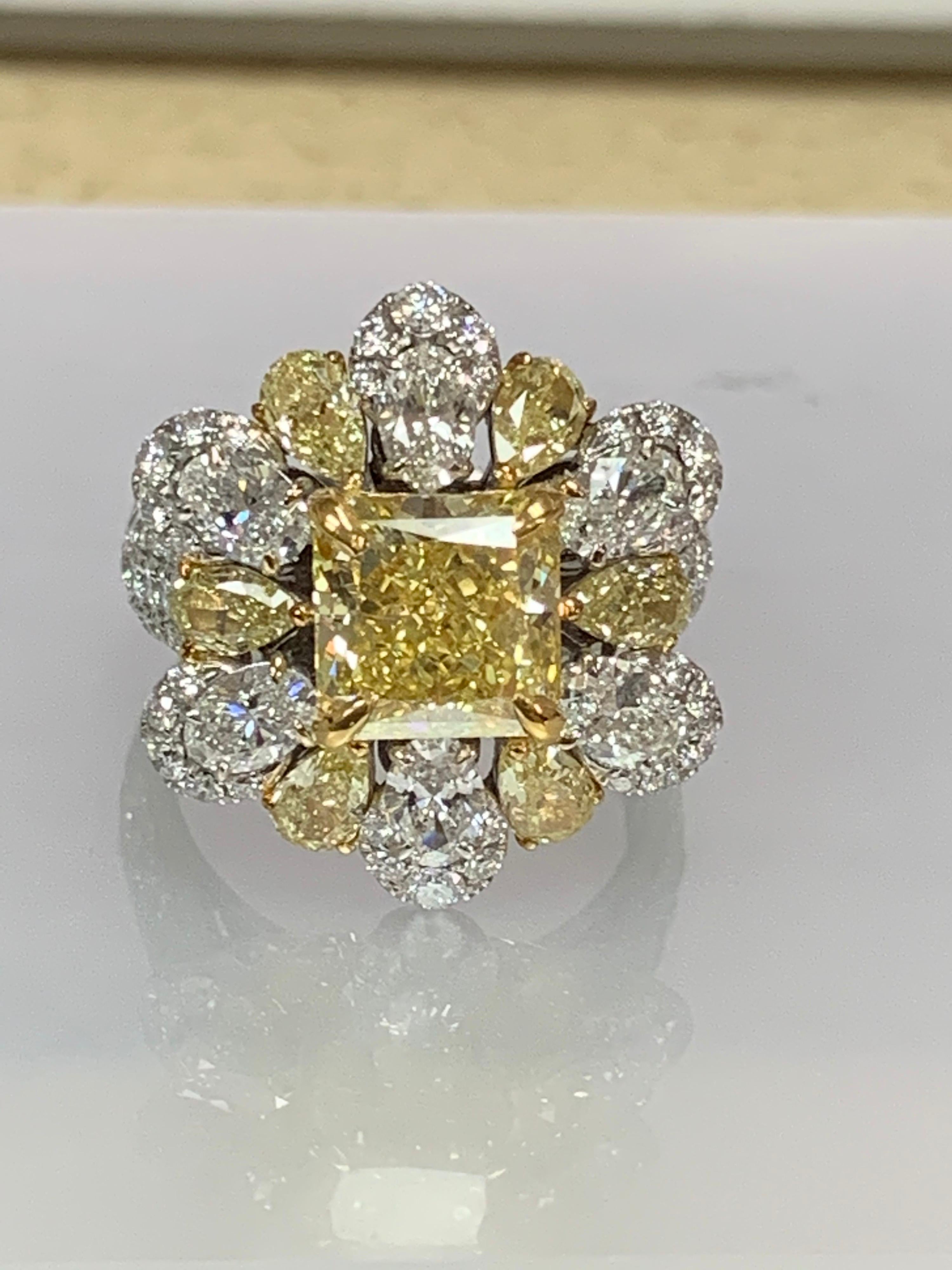 GIA Certified 3.05 center and other diamonds 2.27 Carat white diamonds and 1.27 carat Yellow  on 18 Karat 2 tone gold is one of a kind handcrafted Ring , the ring is well constructed.

The GIA description is as follows 
Clarity grade :IF
Origin: